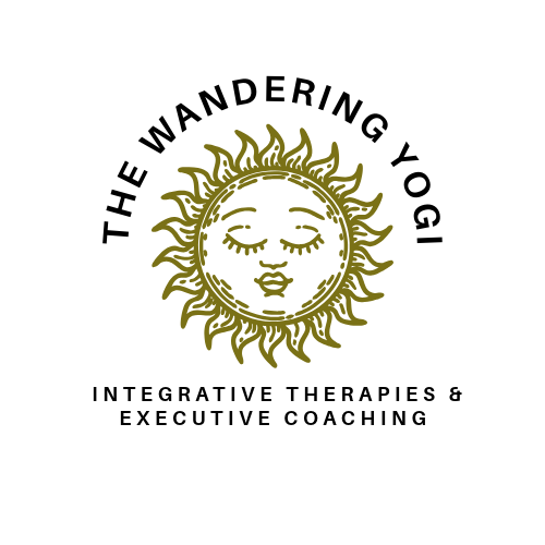 Logo with a sun depicting a peaceful face, surrounded by text "The Wandering Yogi" and "Integrative Therapies & Executive Coaching"