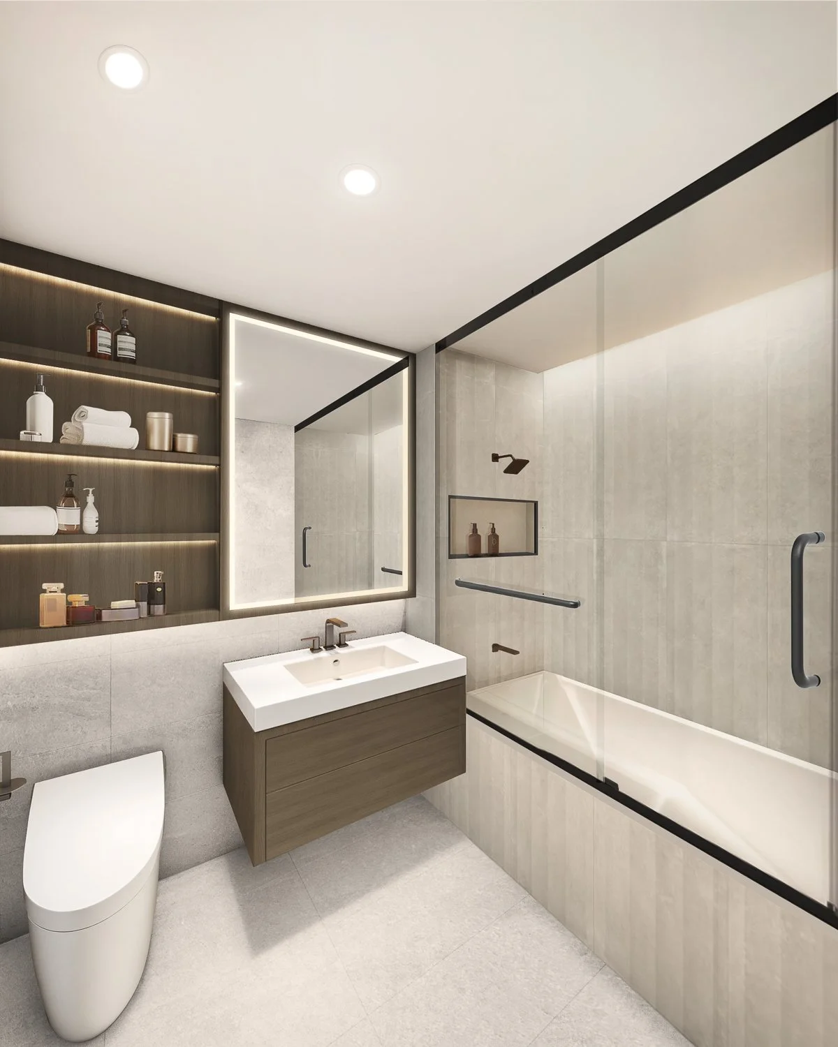 Modern bathroom with a white bathtub, a wooden vanity with a sink, a large illuminated mirror, a toilet, and glass shower enclosure with a black handle, shelves, and towel bars.