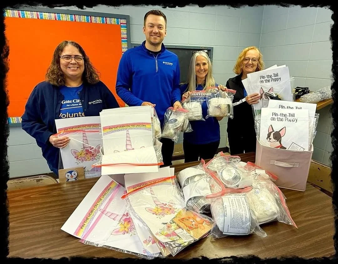 A awesome group from Gate City Bank, took time to assemble party games for our boxes.