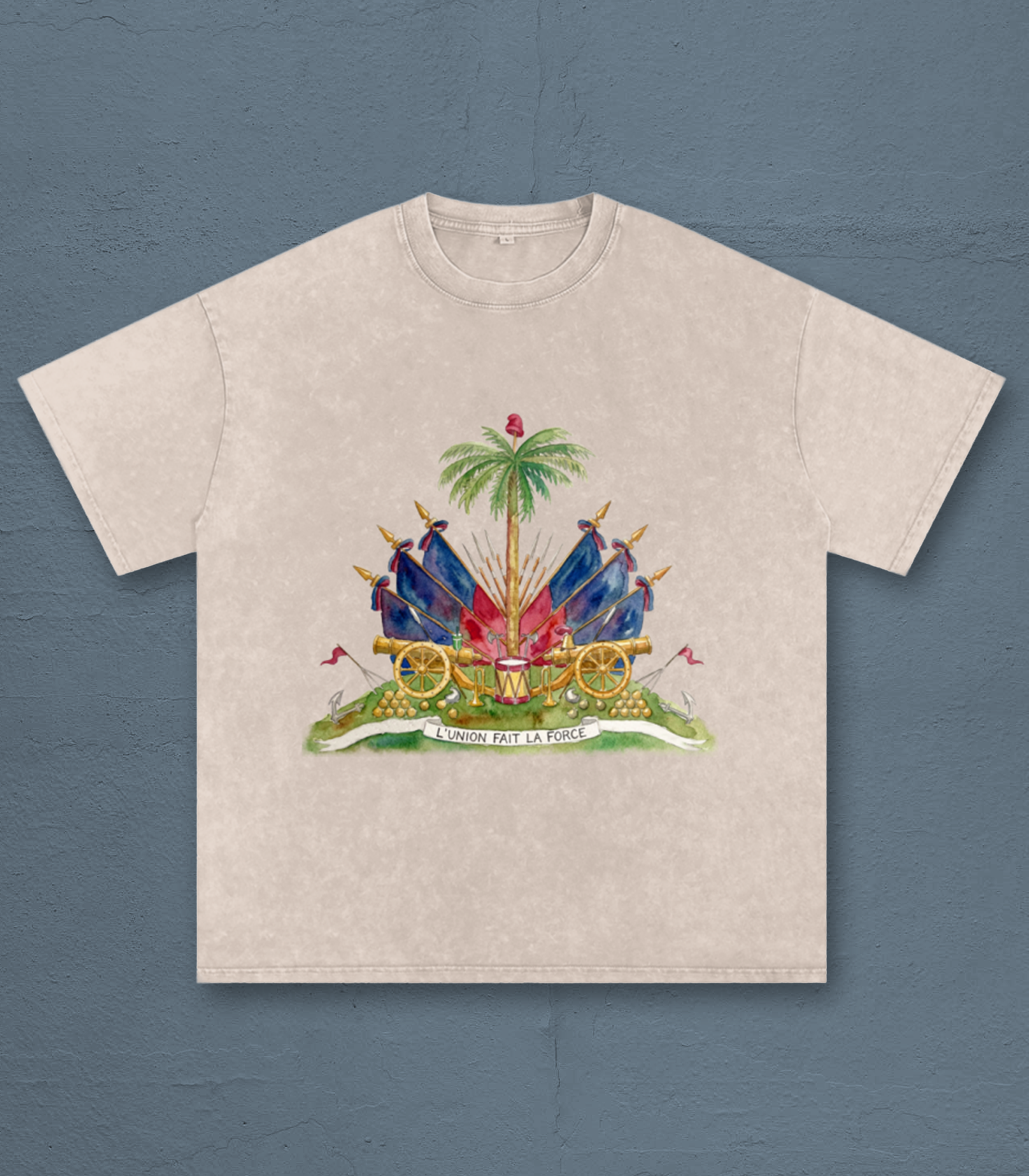 A beige T-shirt featuring a colorful illustration of a central palm tree, surrounded by military artillery, with the phrase 'L'UNION FAIT LA FORCE' written on a banner below.
