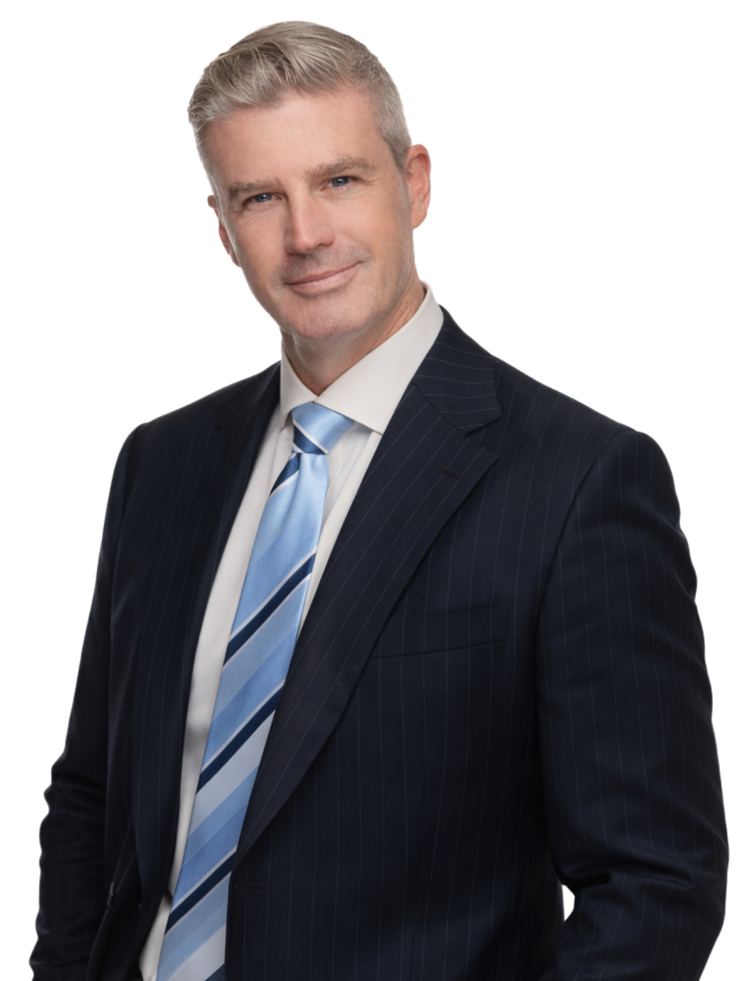 A middle-aged man with short gray hair, dressed in a dark pinstripe suit, light blue tie, and white shirt, posing against a purple and blue background.
