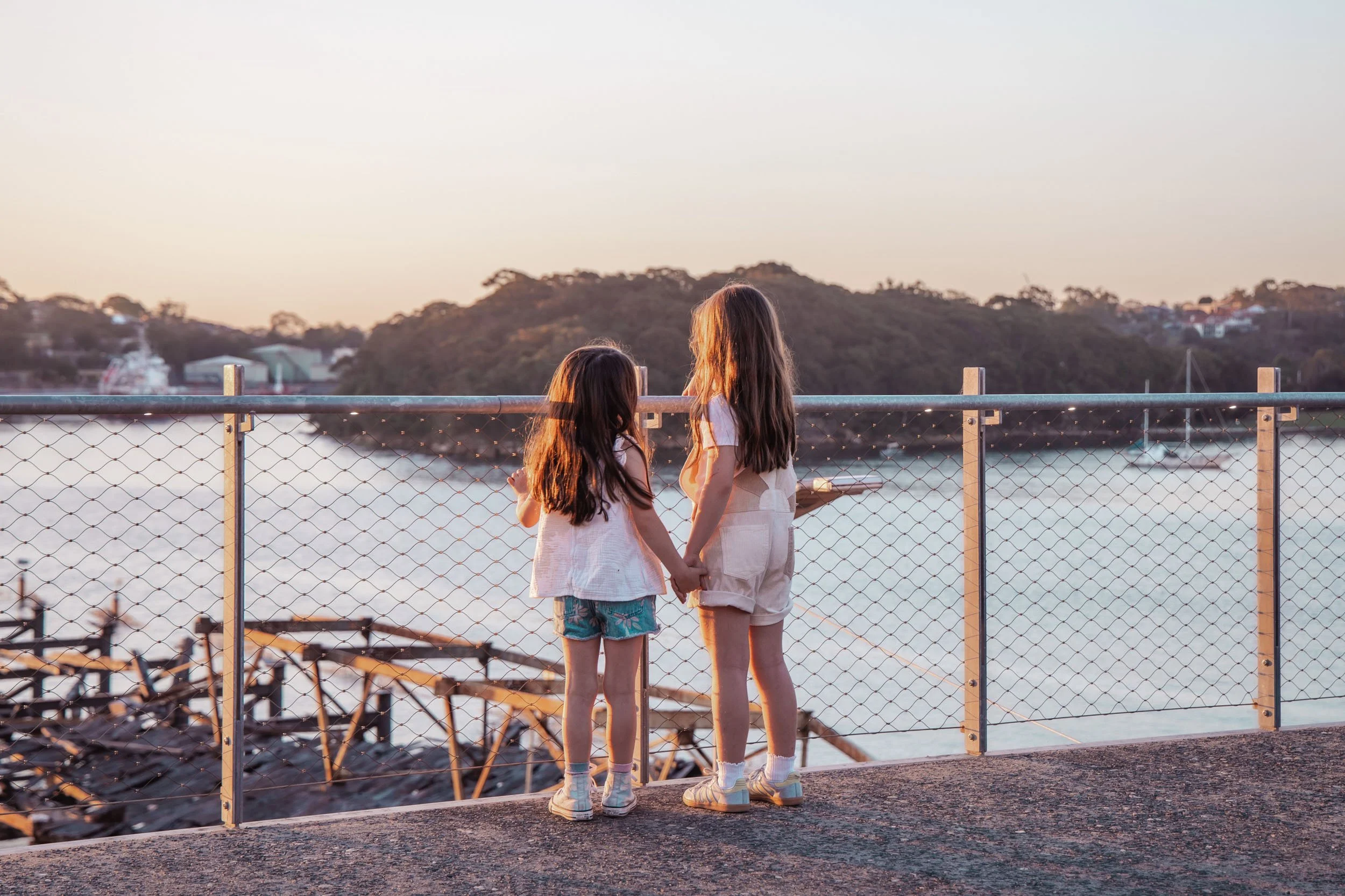 Children looking out over the water at sunset captured by Georgie Meadows Creative Sydney  