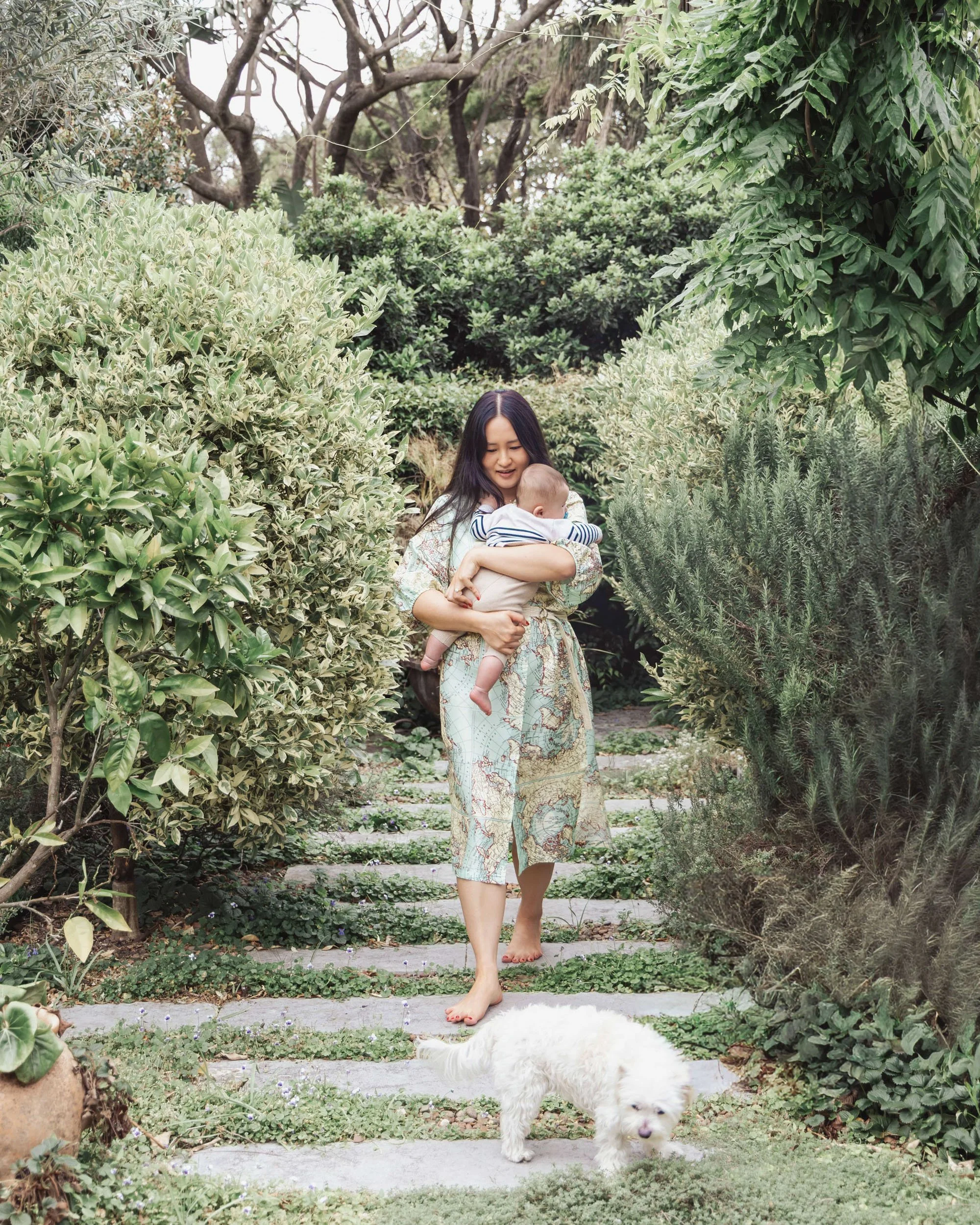 Mother and child walking through a garden captured by Sydney family photographer Georgie Meadows Creative  
