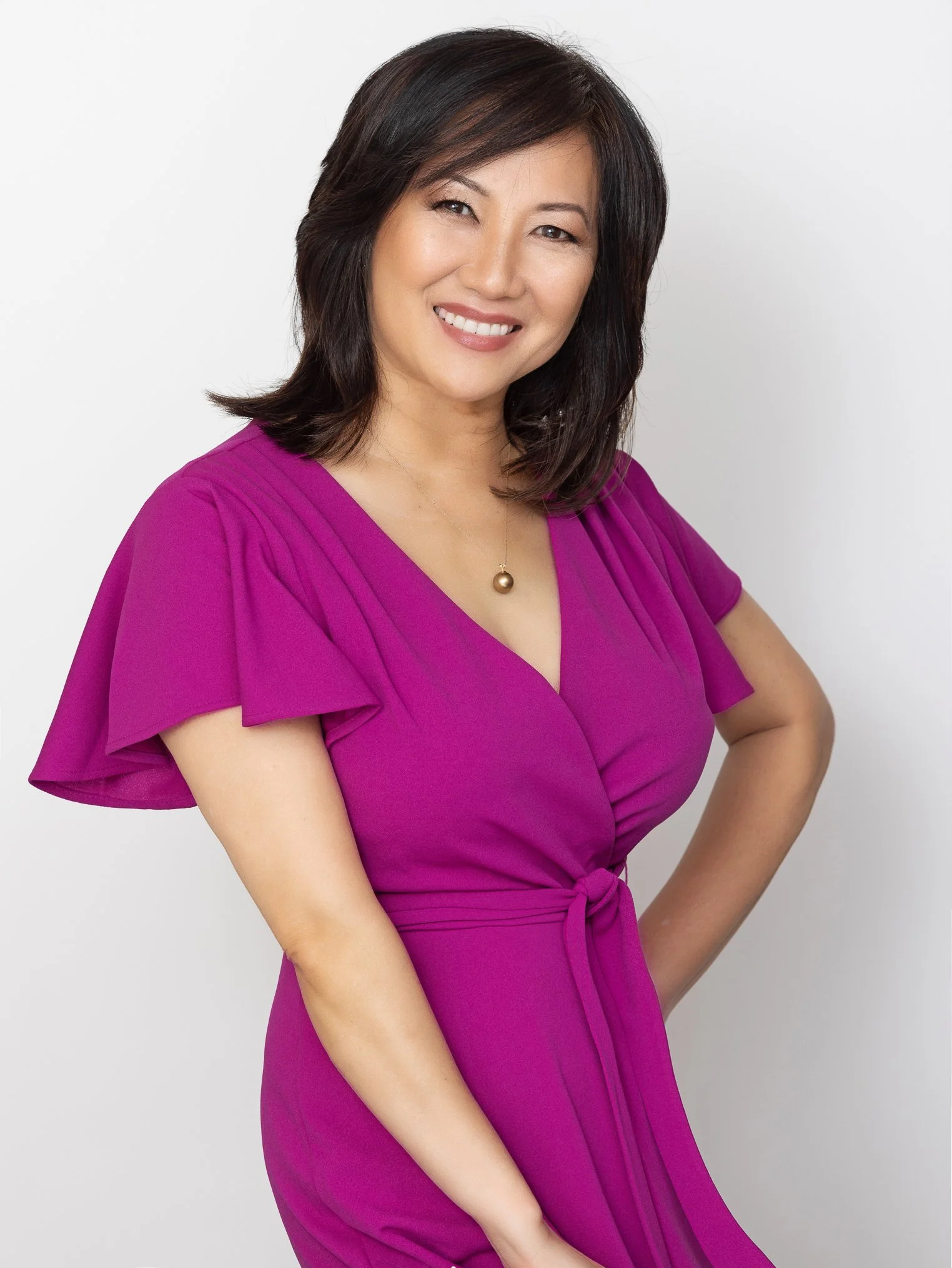 Headshot of an Asian woman in a purple dress. It is Diane Ako, the leading actress and the producer of the film.