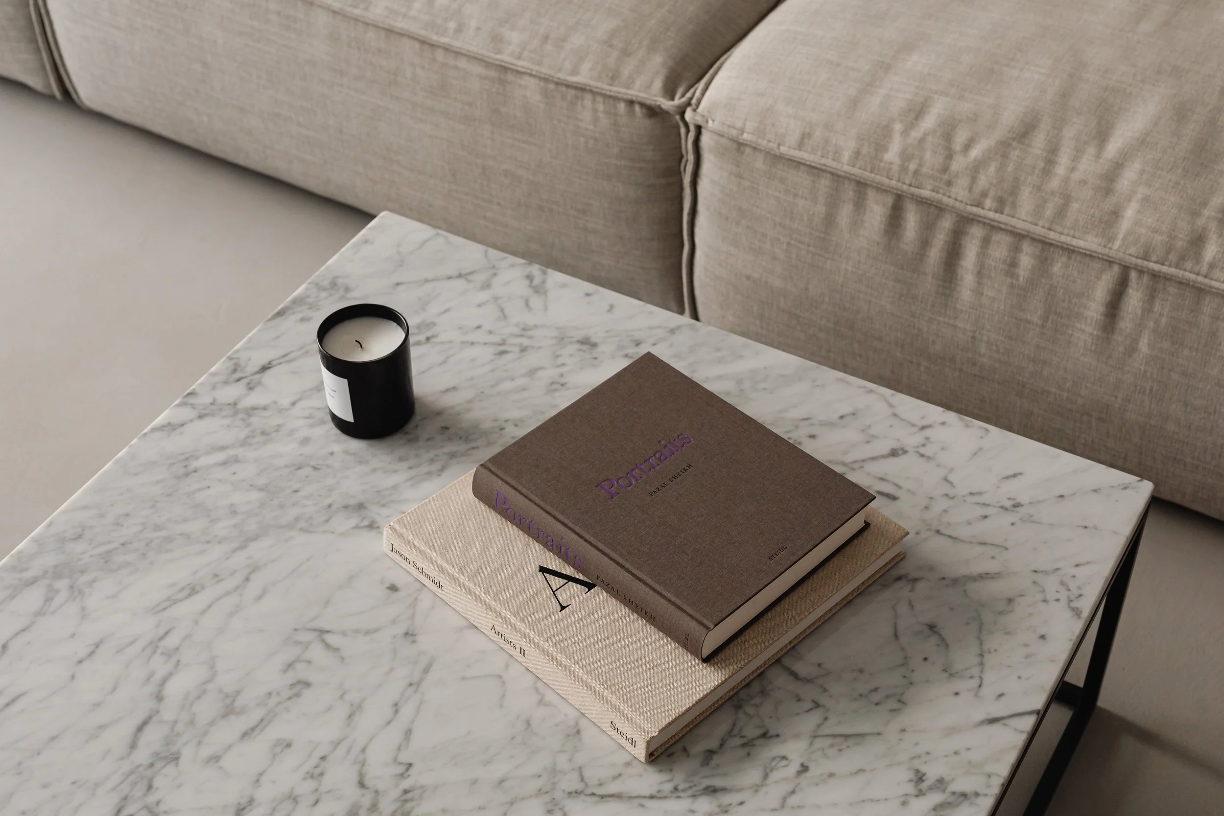 kaboompics_living-room-gray-beige-sofa-marble-coffee-table-coffee-table-books-candle-29393.jpg