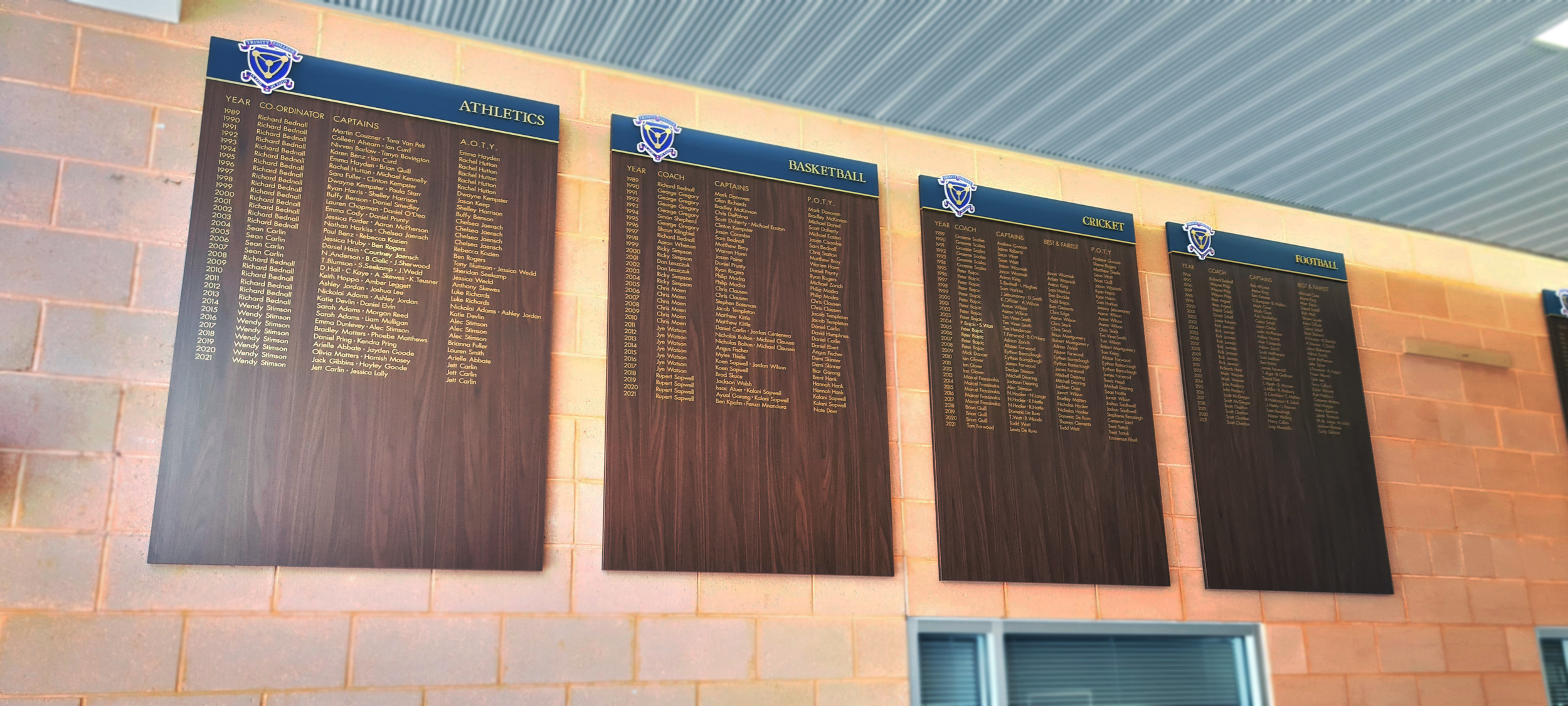 Multi-layered timber boards with vinyl lettering