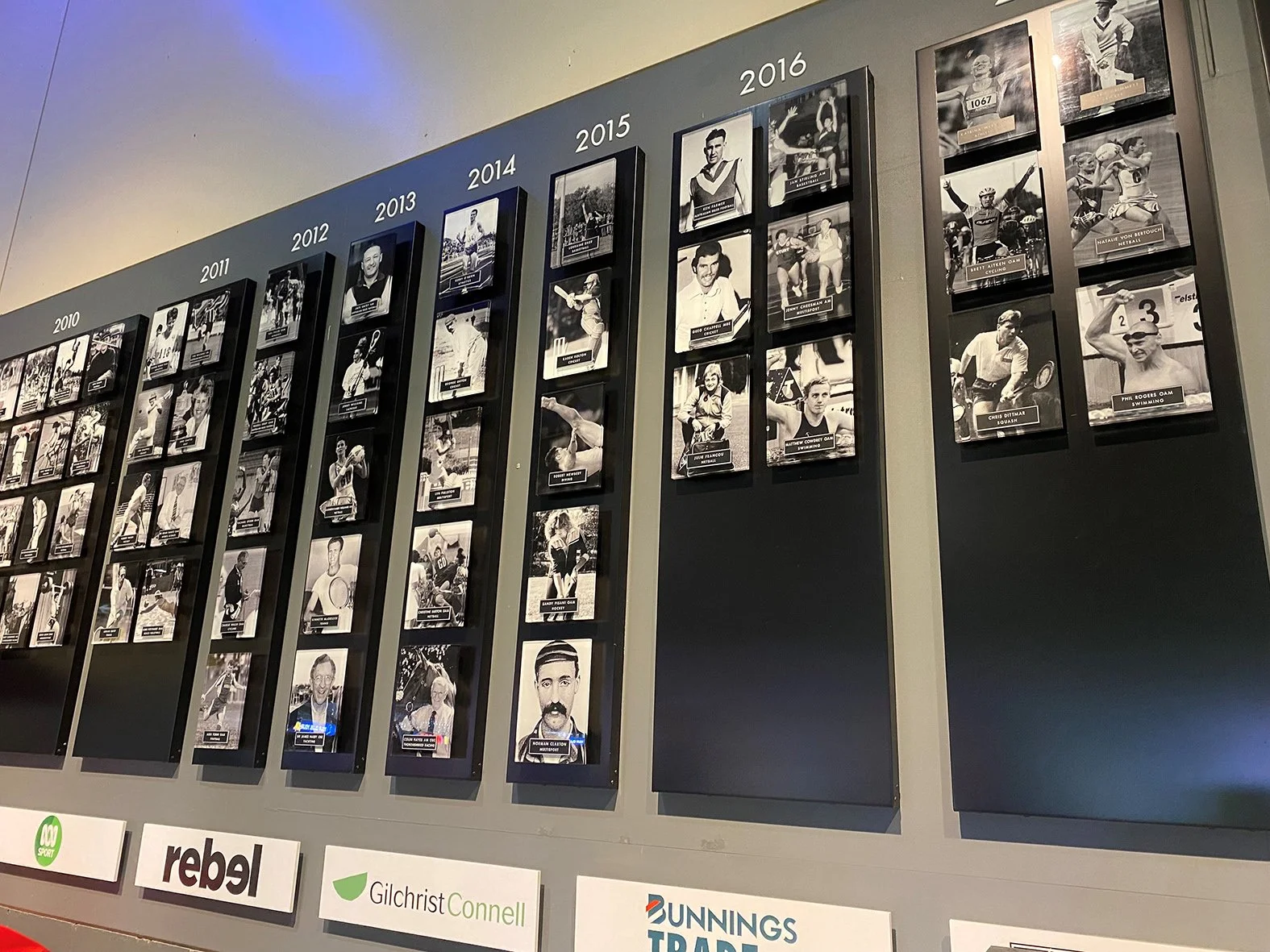 Wall mounted acrylic boards with digital graphics & engraved plaques