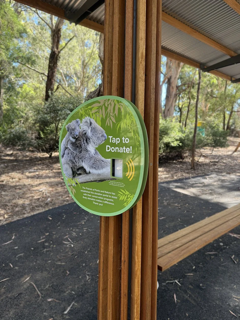 Custom fabricated tap & go donation signage
