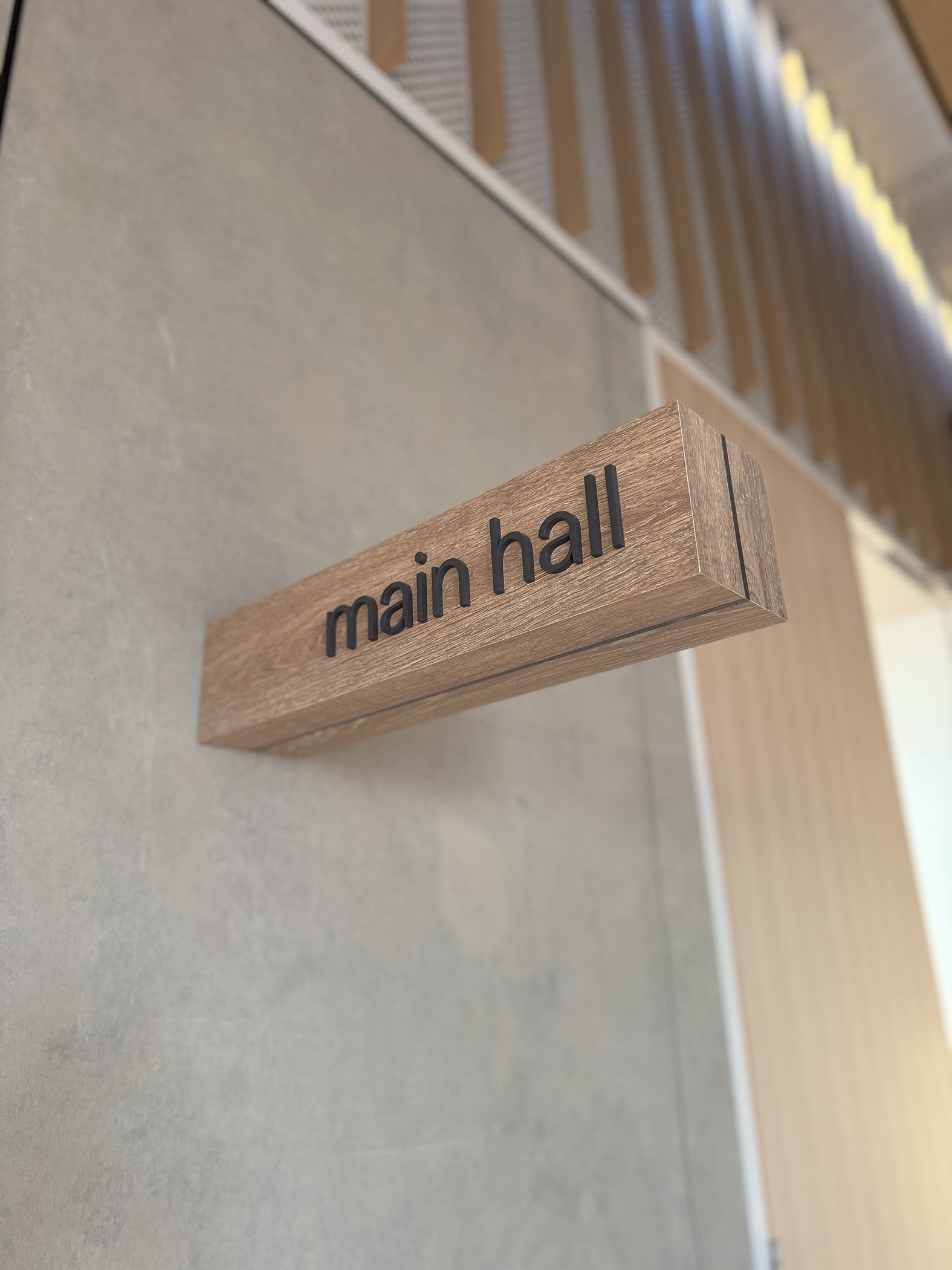 Wall mounted timber with acrylic lettering