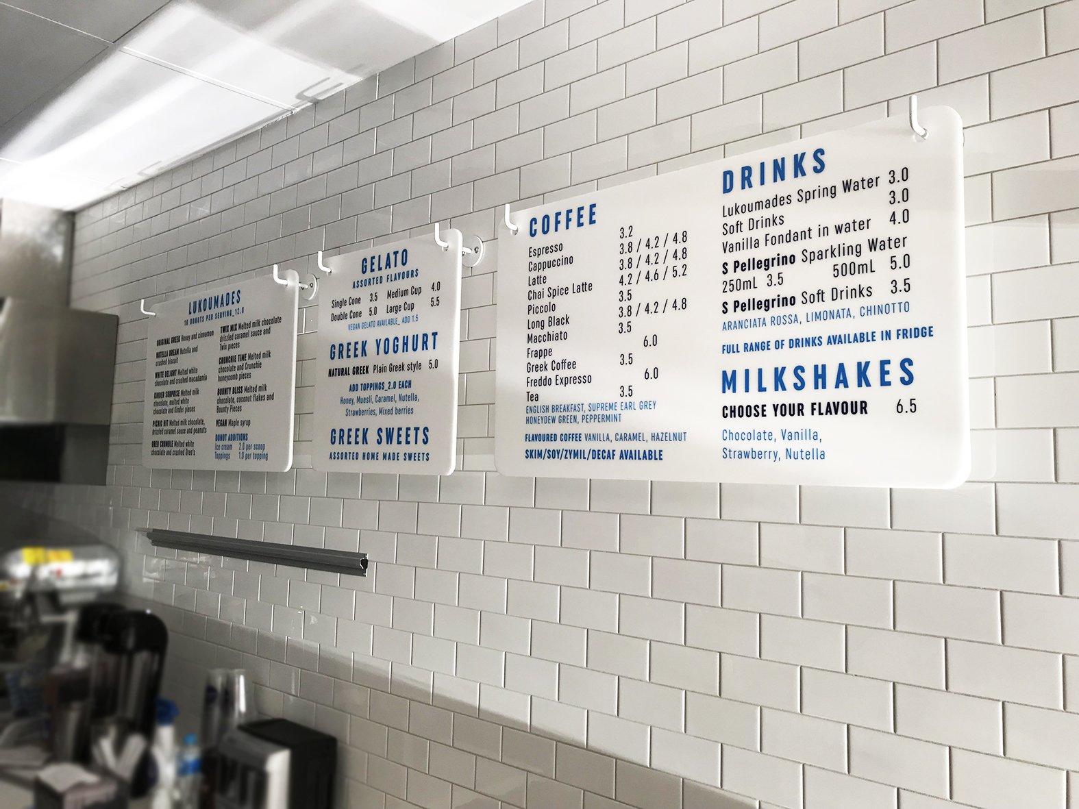 Hanging menu boards with vinyl lettering