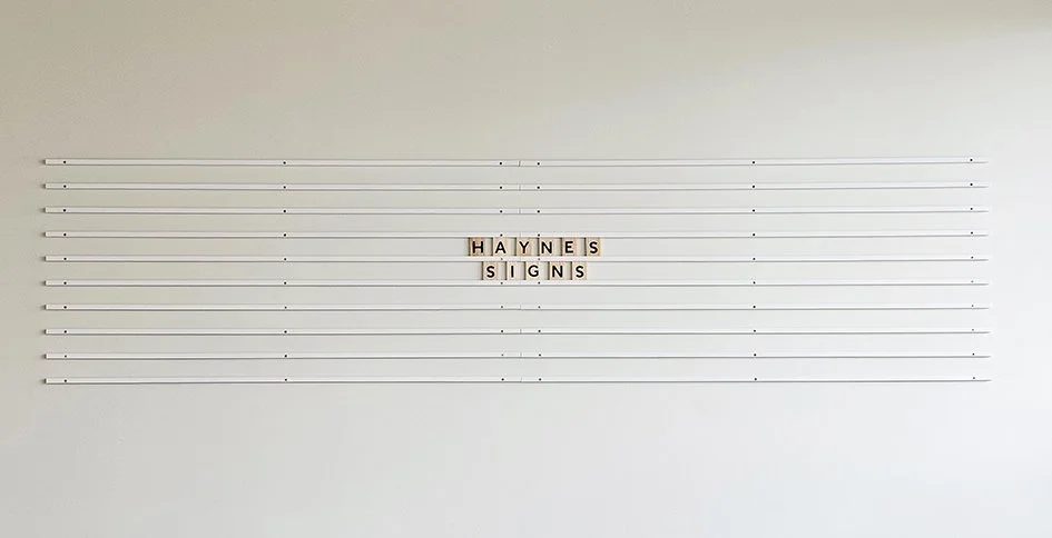 Rail menu board with wooden tile letters