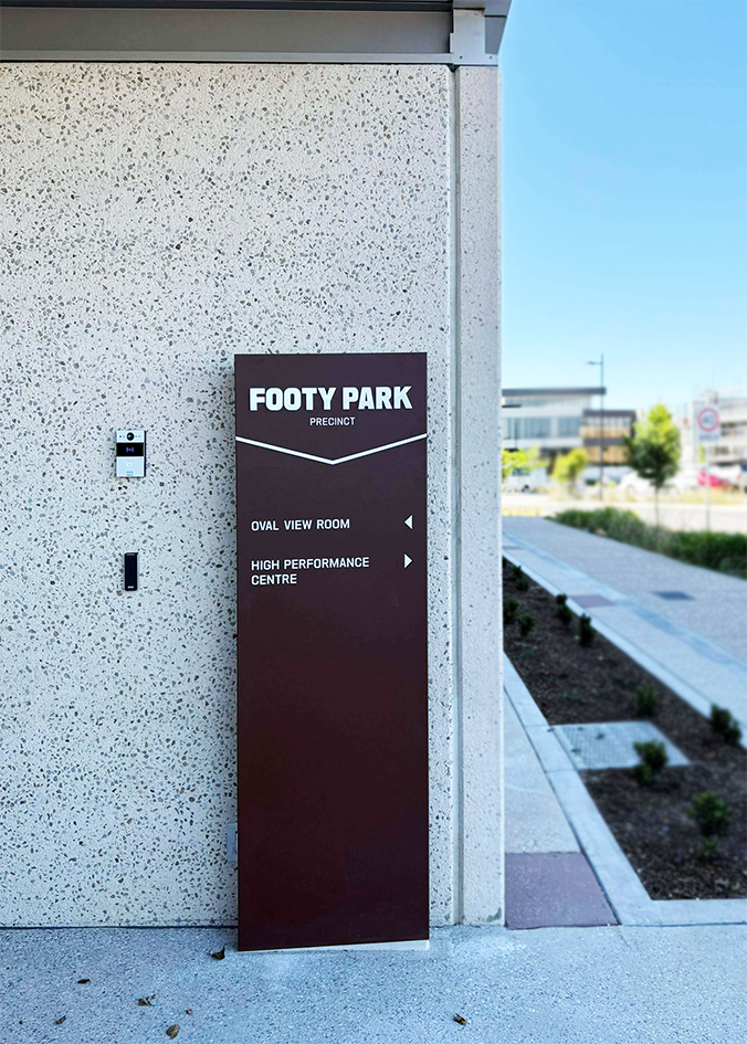 Corten blade signage with acrylic lettering