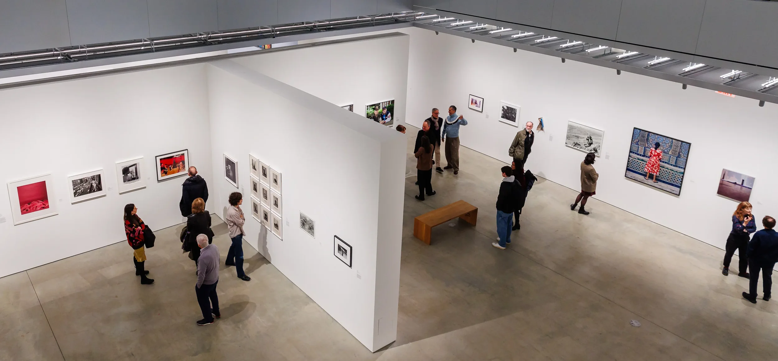 An art gallery with framed photographs on the walls