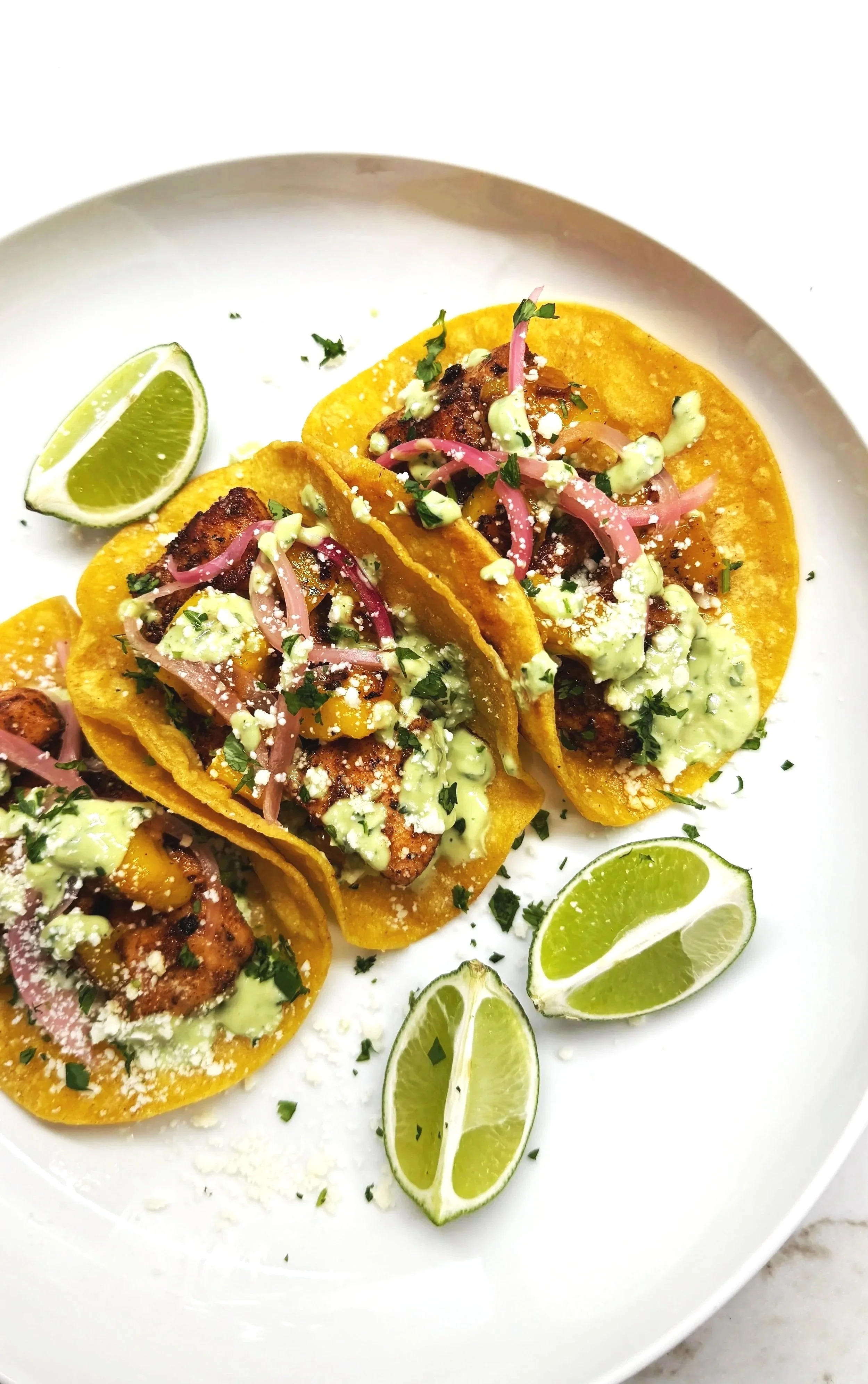 Salmon Tacos with Seared Mango &amp; Avocado Crema