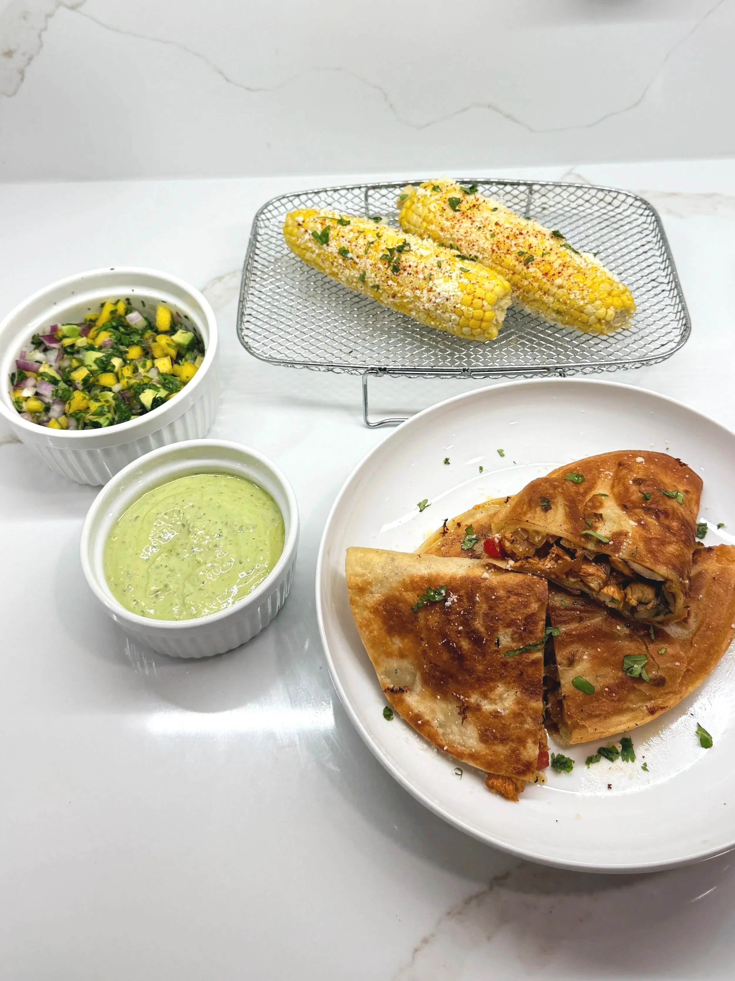 Chipotle Citrus Chicken Quesadillas&nbsp;&nbsp;Served with Mango Salsa and Poblano Crema &nbsp;