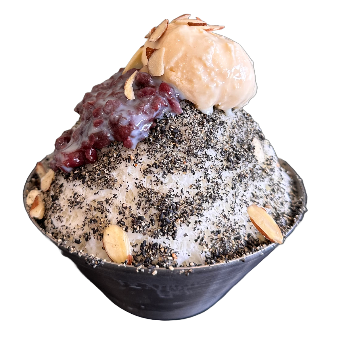 A bowl of shaved ice topped with almond slices, red beans, a scoop of vanilla ice cream, and black sesame seeds.