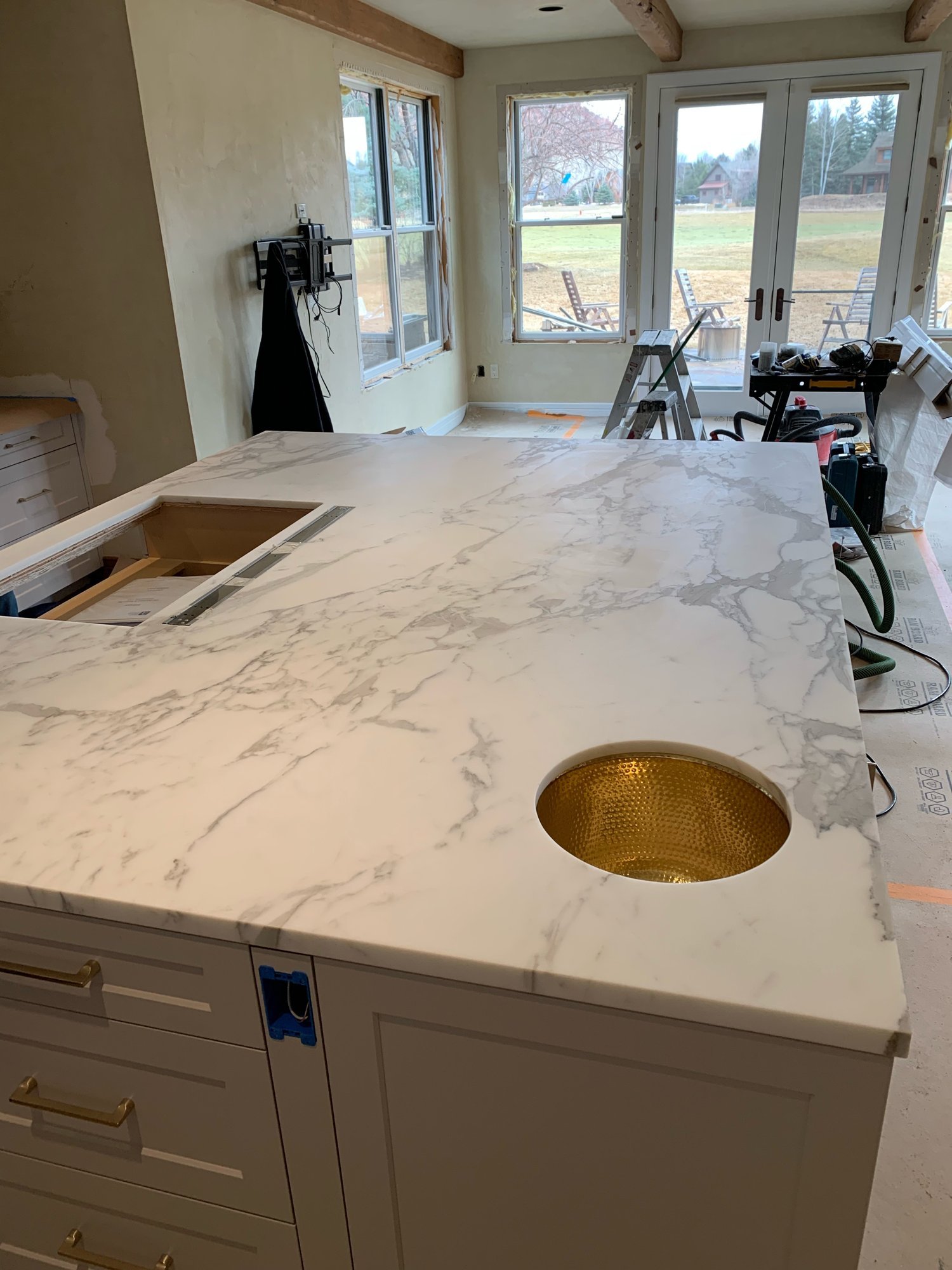 11-white-marble-island-brass-sink.jpg