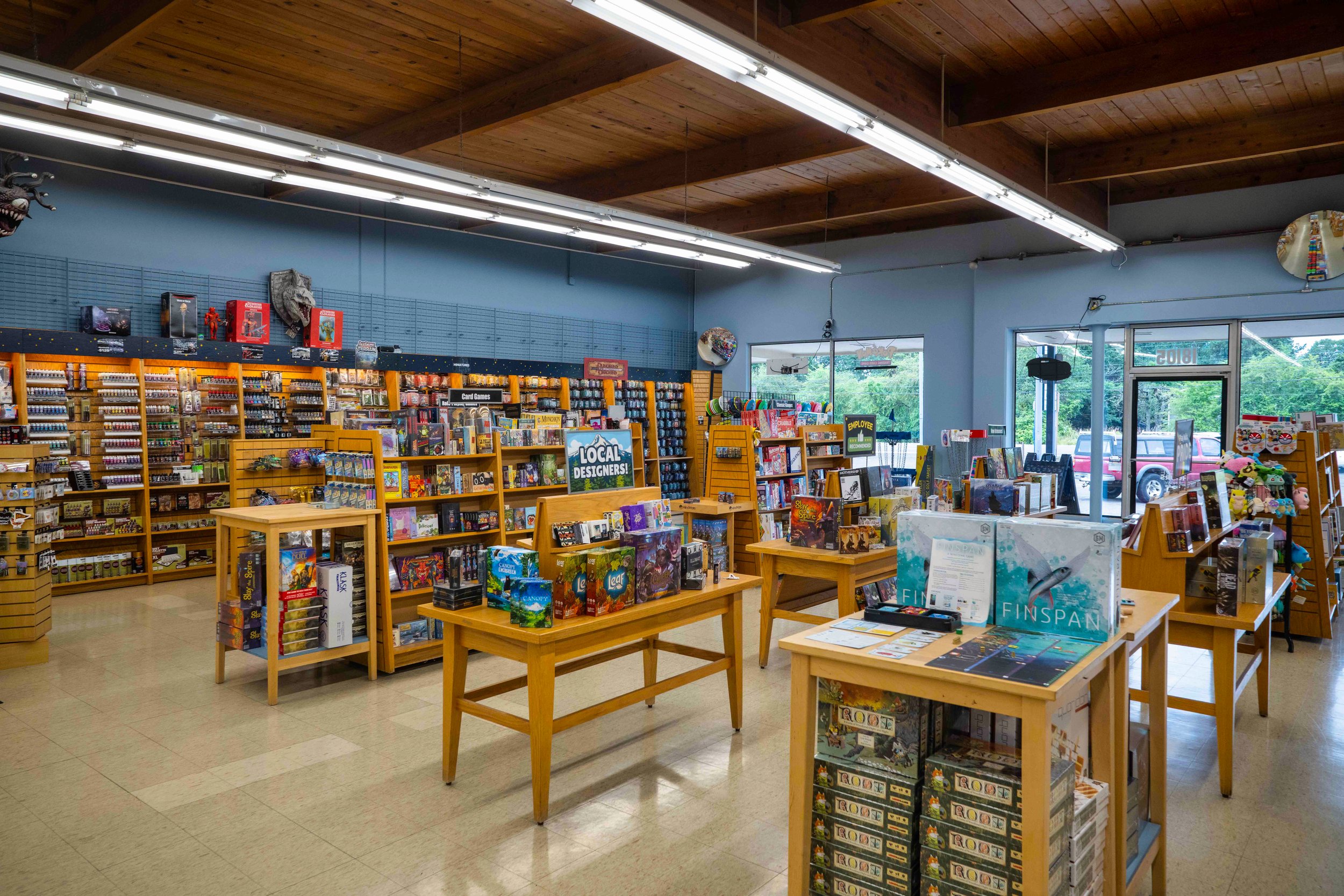 Bright Aloha Guardian Games store with shelves of games on display