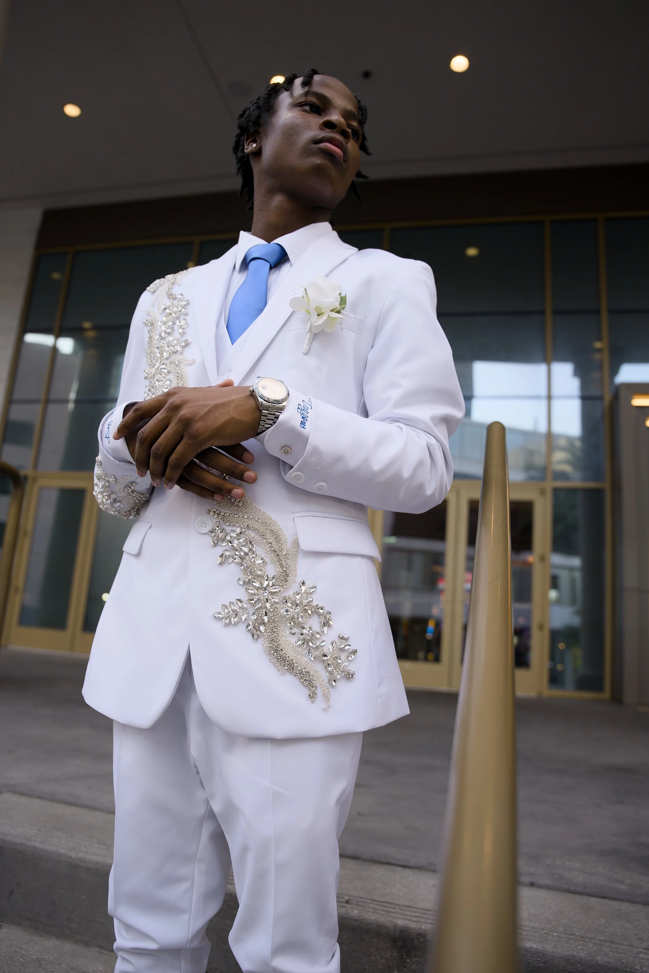 8th grade prom full body portrait white suit casino entrance Canal Street New Orleans Crescent Lens