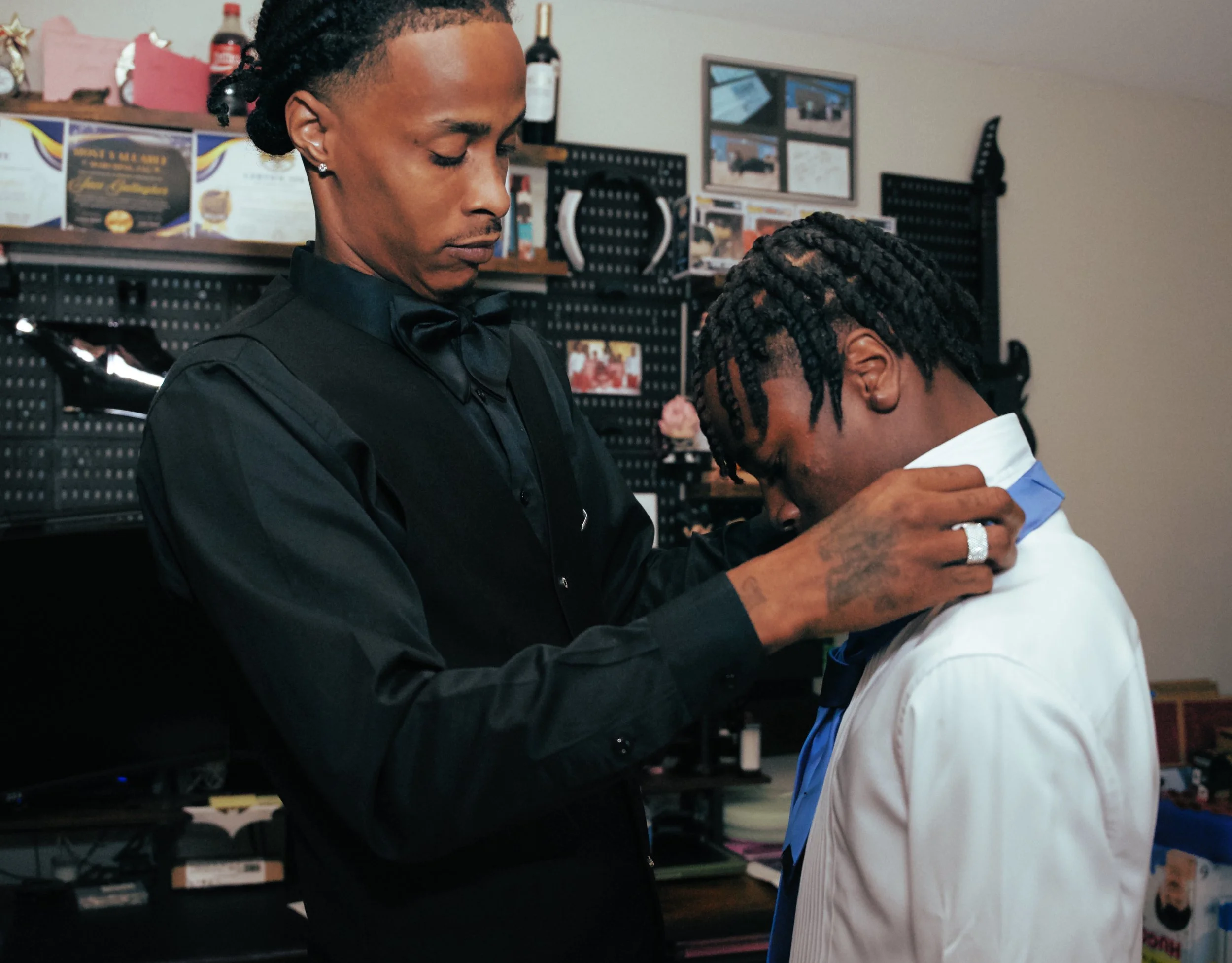 Father adjusts son's tie before 8th grade prom night New Orleans portrait session Crescent Lens