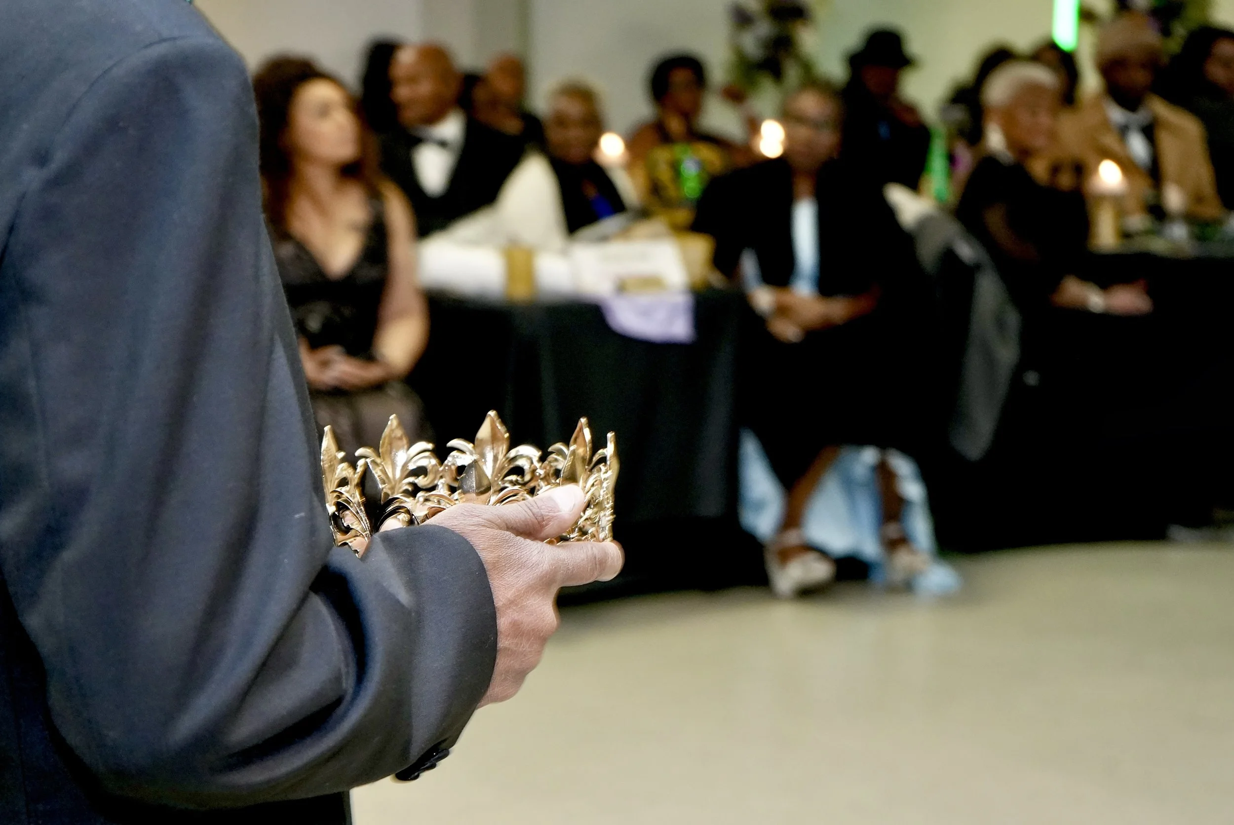 2025 King holds the crown moments before the passing of the reign — NOBDA Mardi Gras Ball New Orleans