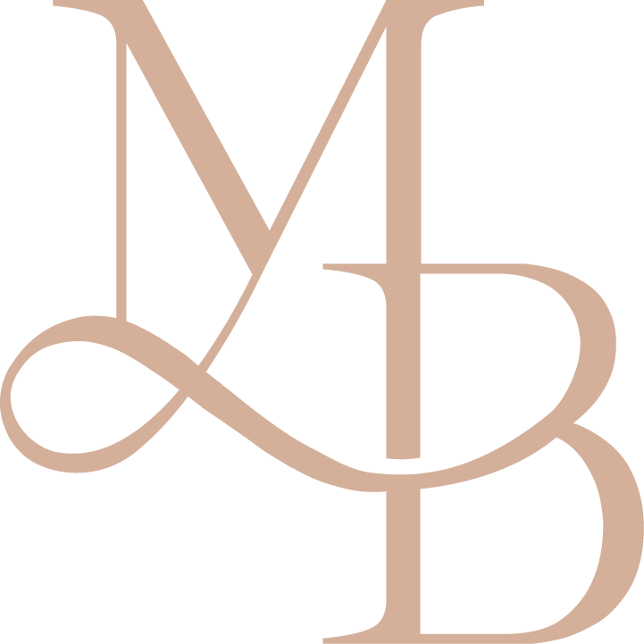 A monogram with intertwined initials L, M, D, and B in a stylish, cursive font, on a black background.