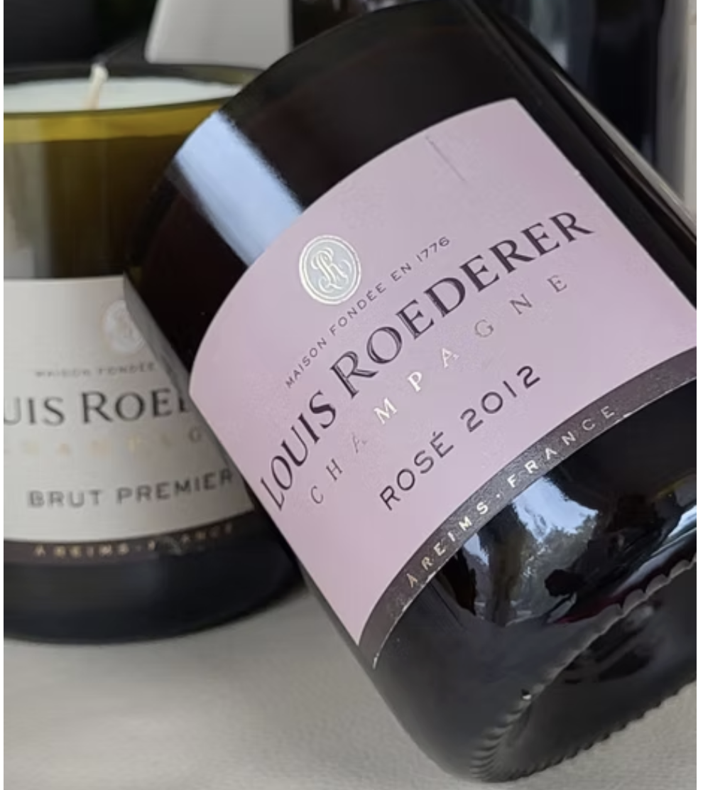 Candle made from recycled Louis Roederer bottle.png