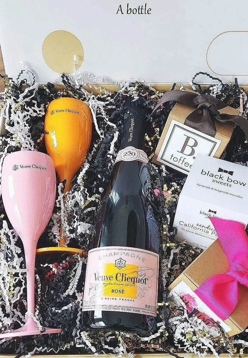 Veuve Clicquot Rosé with two acrylic flutes and gourmet snacks.jpg