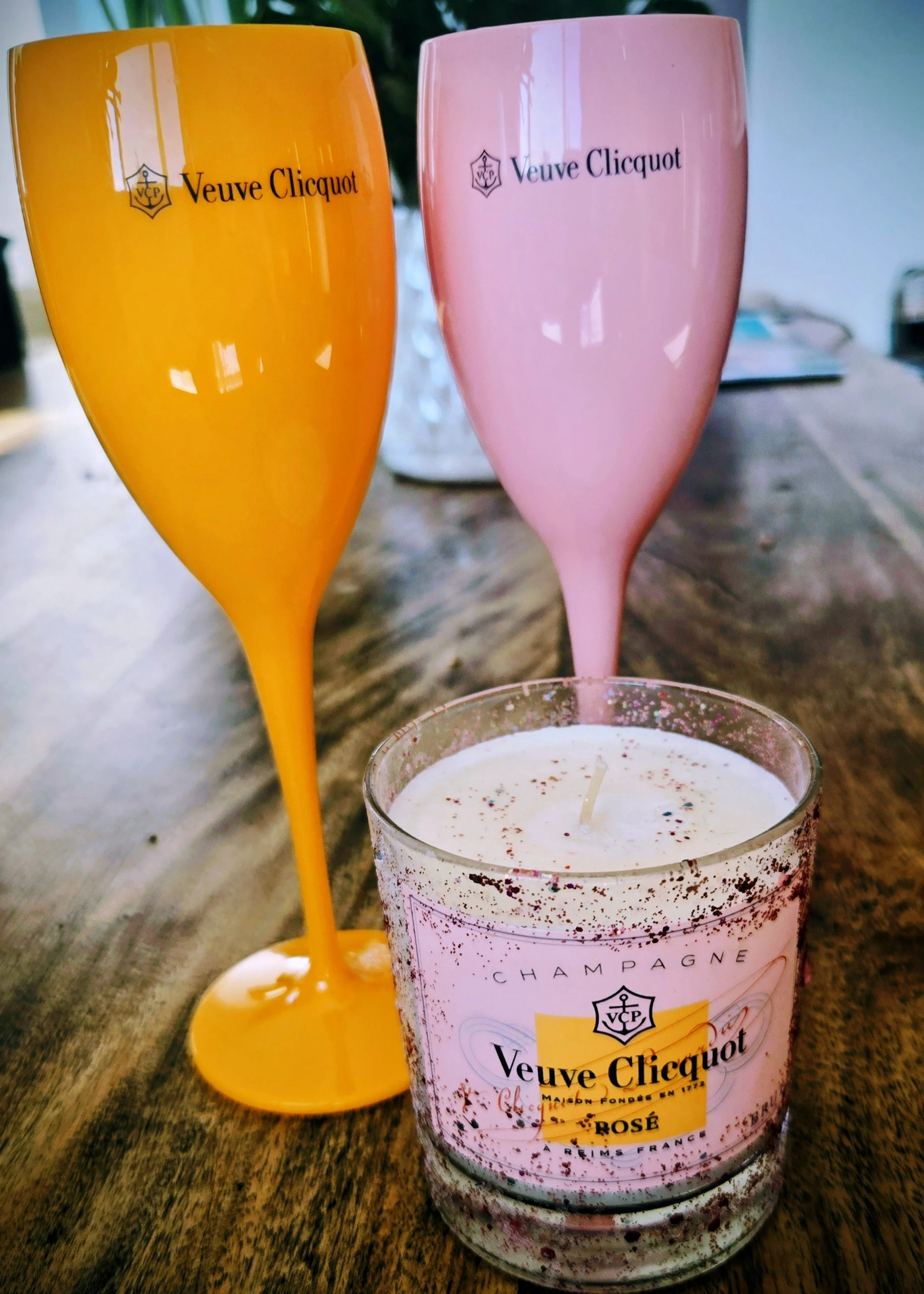 Two Veuve Clicquot brand acrylic flutes with aromatic candle.jpeg