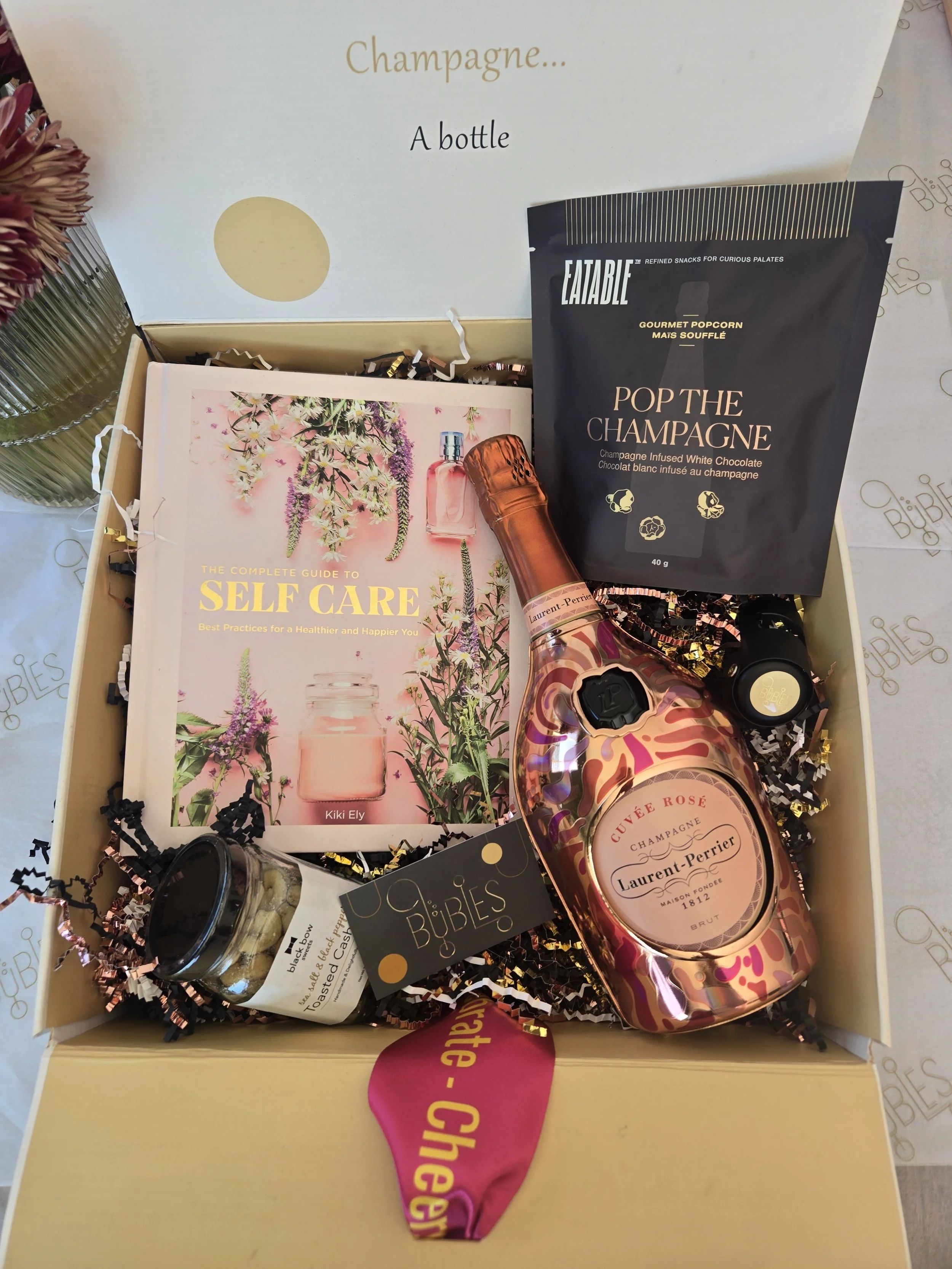 Laurent Perrier Rose with selfcare book.png