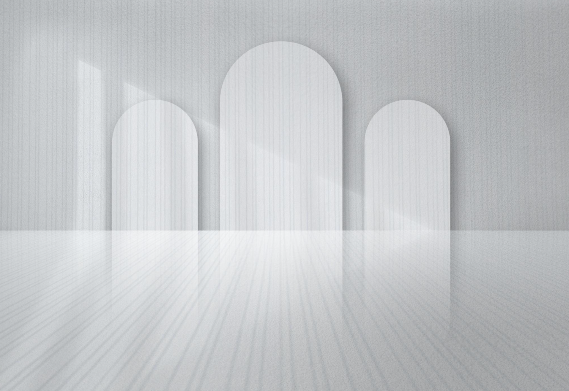 A modern, minimalist architectural interior featuring three large, white, rounded arches on a grey textured wall with a reflective grey floor.