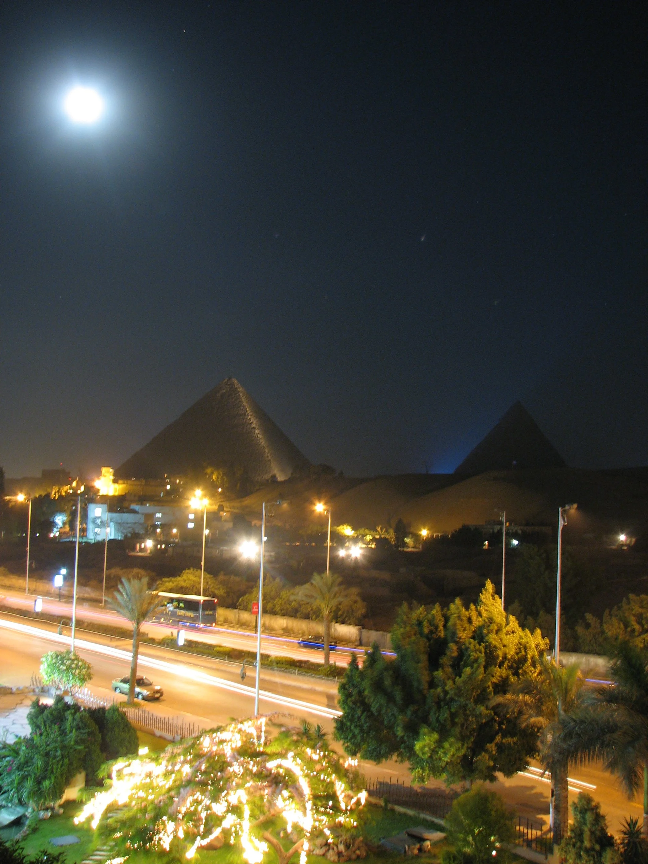I like this picture because The Great Pyramid almost looks like there is lava flowing down and the Pyramid of Khafre is backlit by the light show that played nightly at the pyramid complex.