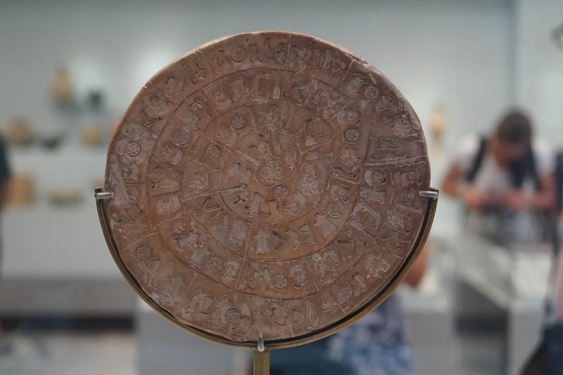 Crete - The Phaistos Disc at The Archeological Museum of Heraklion. To this day it has not been deciphered.
