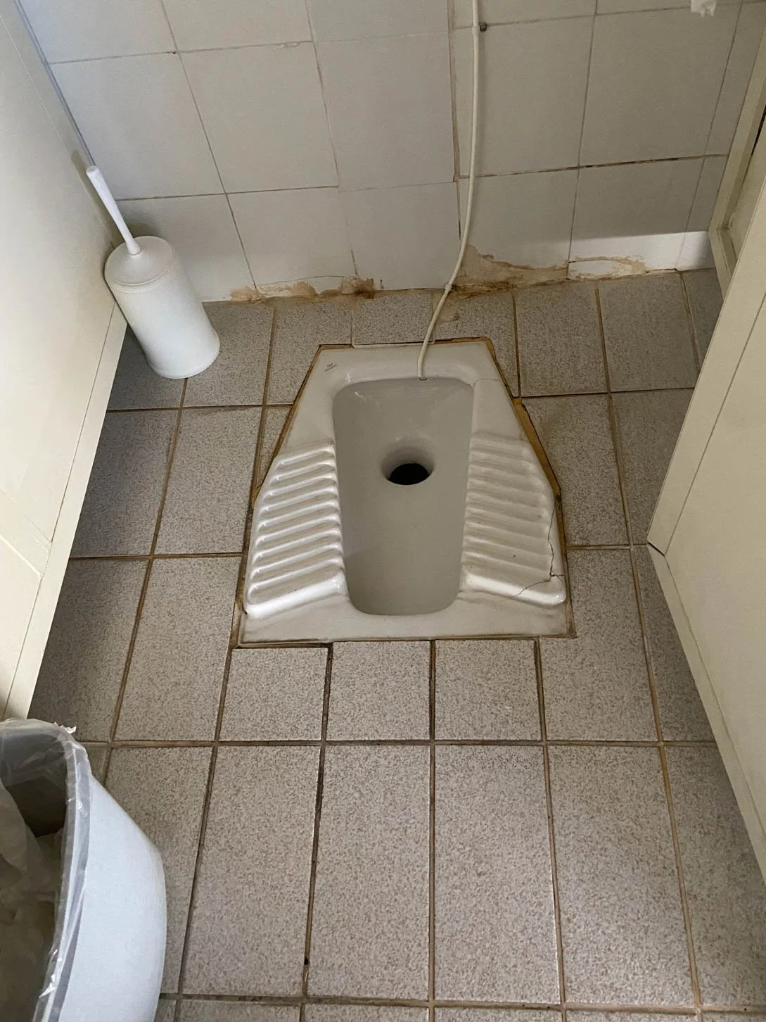 Toilet at The Holy Monastery of St. Stephan. Natalie had to use the bathroom, when she saw it was this type of toilet, she didn't have to use the bathroom anymore.