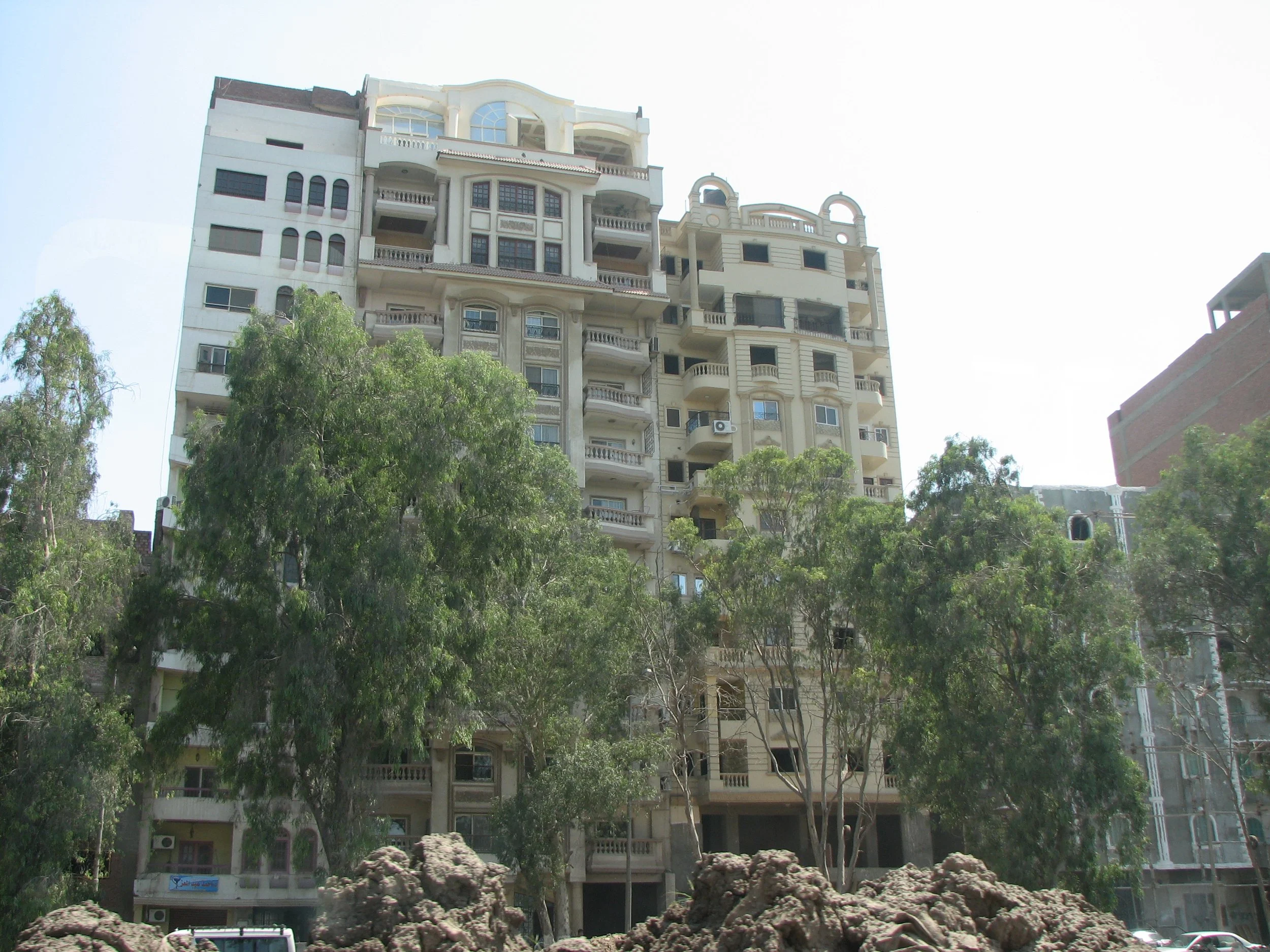 Views from around Cairo. This is an example of how to get around property taxes. As long as the facade of the building is unfinished, the property isn't taxed. The different units inside are completely finished and inhabited.