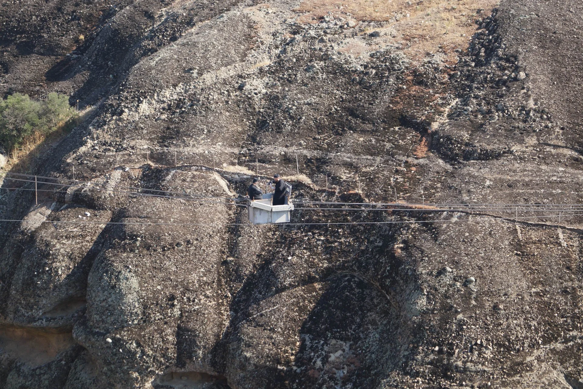 Holy Monastery of The Great Meteoro. There was a system of cables and this little car that would take the monks across the valleys.