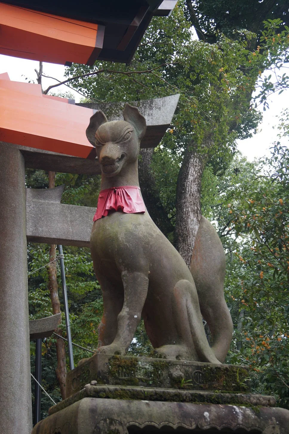 Kyoto - Fox guarding Torii gates at Fushimi Inari Shrine