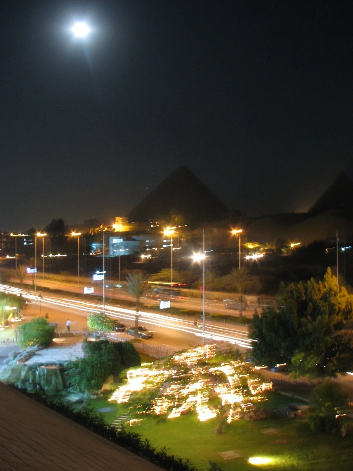 Another view of The Pyramids of Giza at night