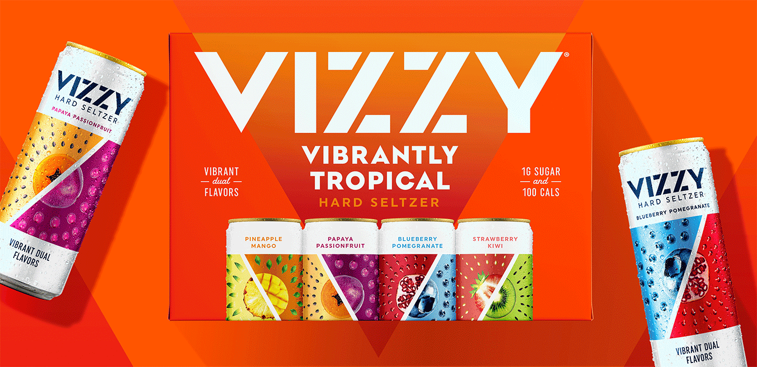 A colorful box of Vizzy hard seltzers with assorted cans displayed and two additional cans angled on either side, featuring flavors like papaya passionfruit, blueberry pomegranate, pineapple mango, and strawberry kiwi, set against an orange background.