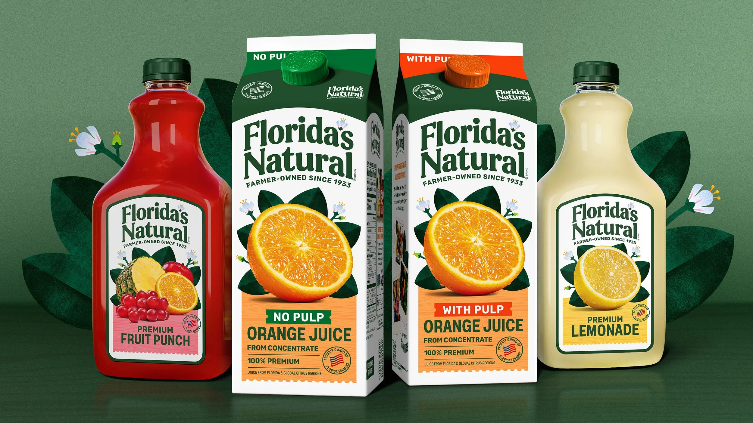 Three Florida's Natural juice cartons with citrus fruit images and a background featuring dark green leaves.