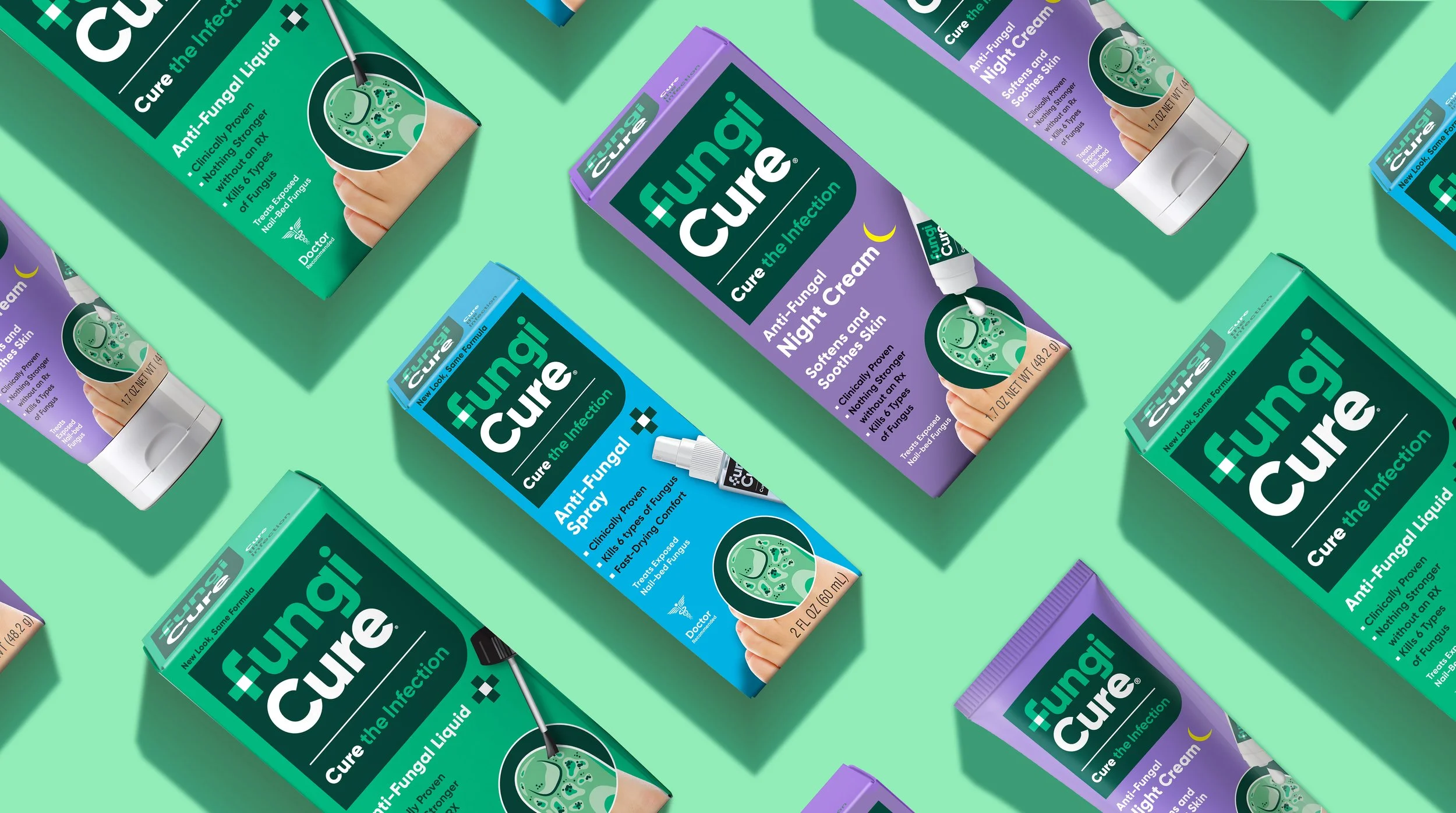 Multiple boxes of Fungicure anti-fungal treatment products in various colors, including green, purple, blue, and teal, displayed on a green background.