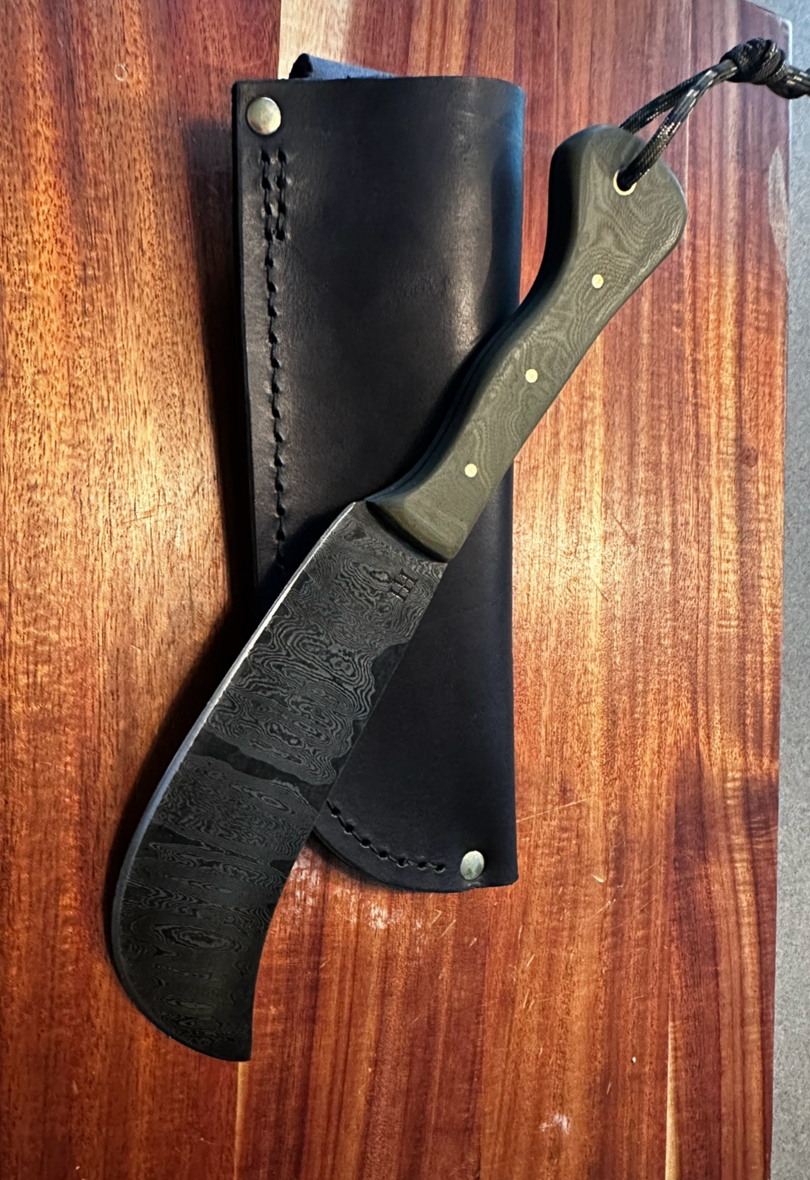 Large damascus skinning knife with green G10 handle