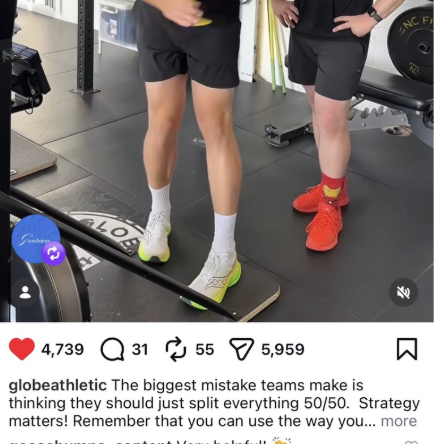 Two people standing on a scale in a gym. One person is wearing white sneakers and black shorts with yellow accents, and the other is wearing red sneakers and black shorts. Fitness equipment is visible nearby.