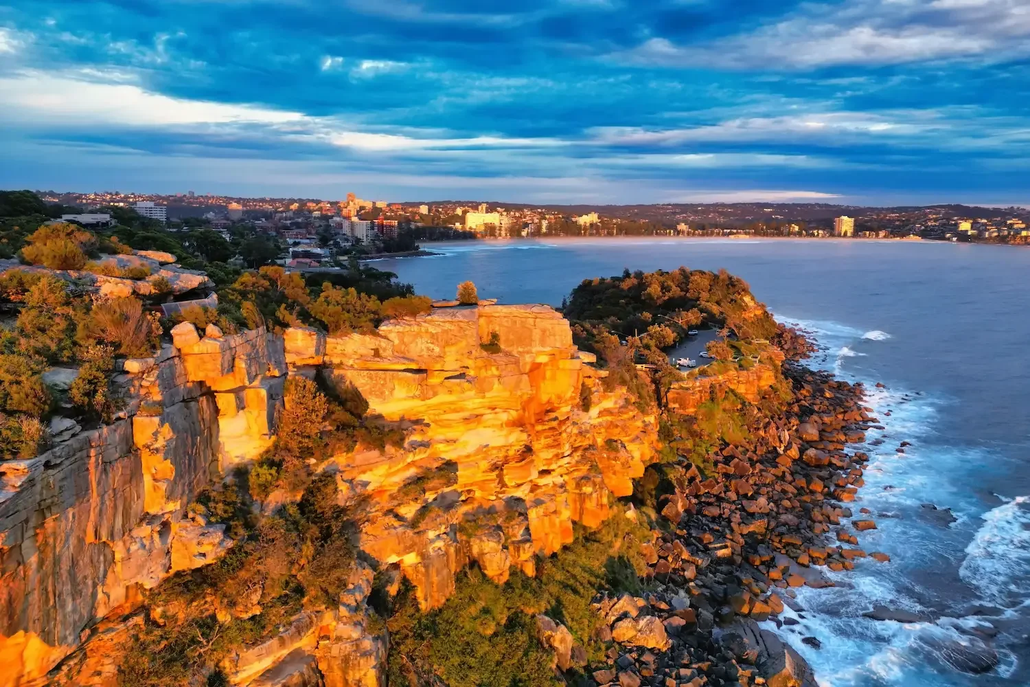 drone-shelly-headland-sunrise-cliff-manly-sydney.webp