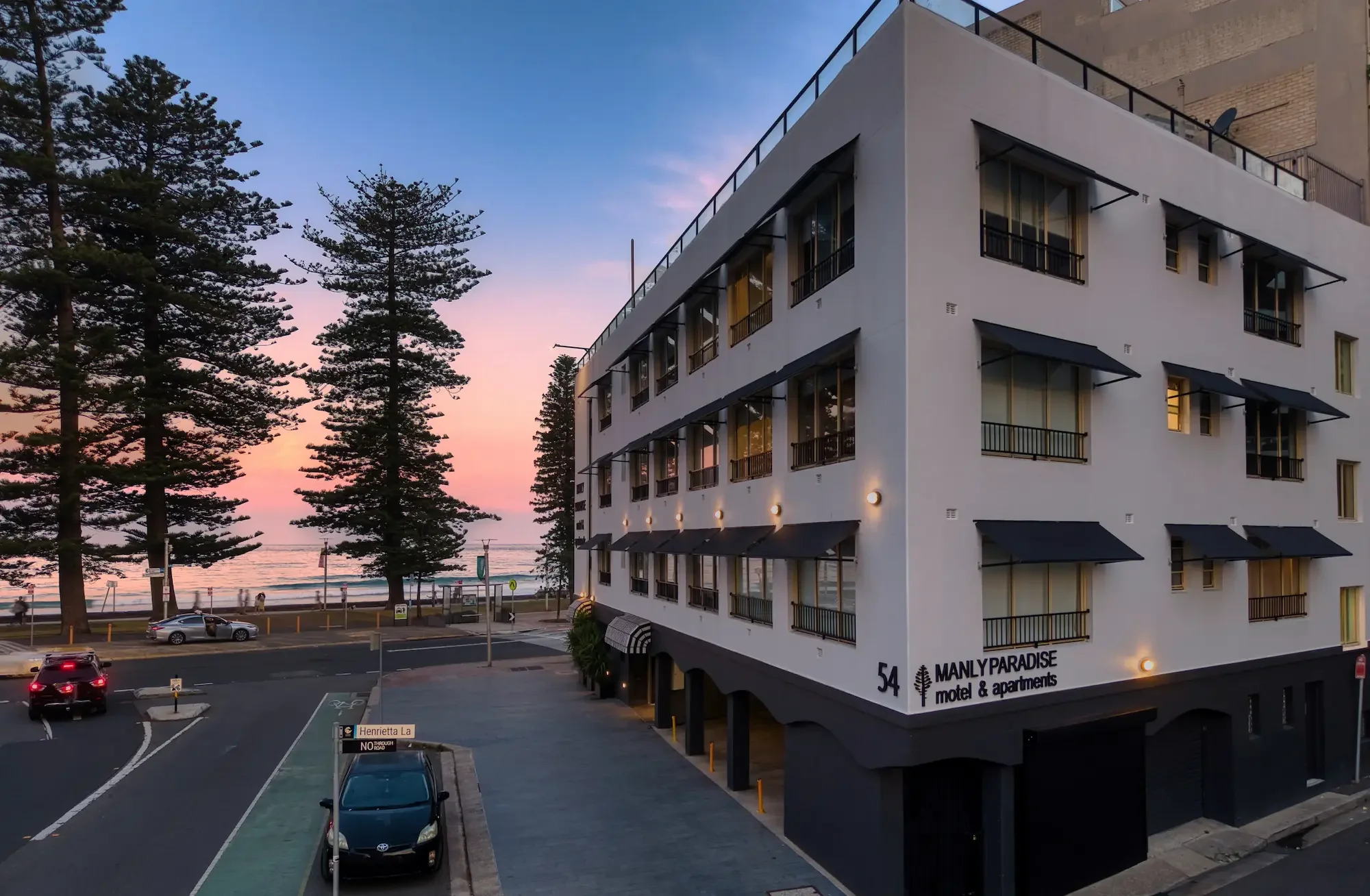 Drone content creation aerial photograph of Manly Beach Paradise Motel at sunrise Sydney NSW — Batuti Photos