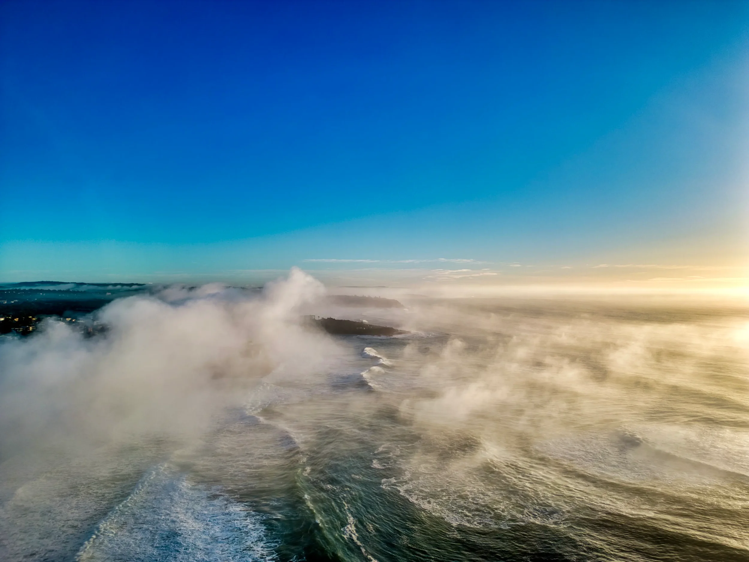 sydney-aerial-photography-manly-beach-fog.webp