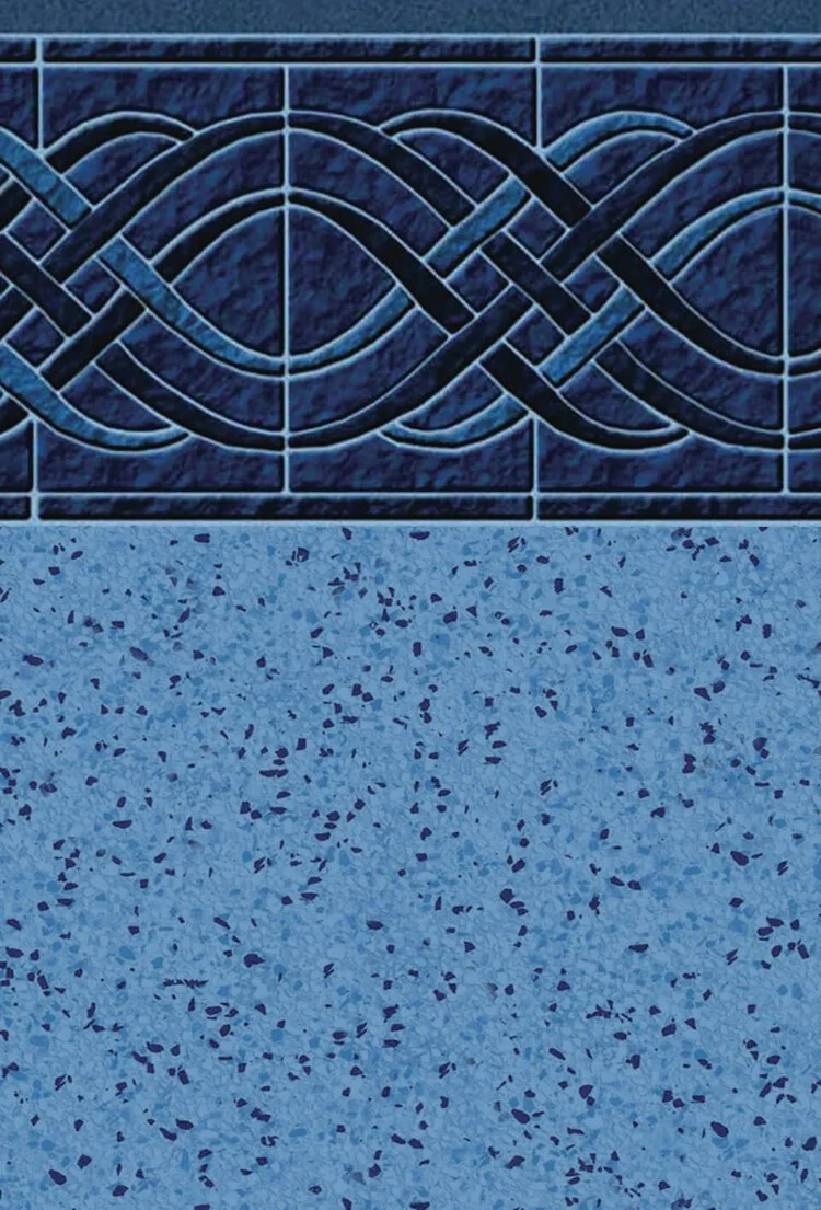 Close-up of a decorative tile wall with intricate knot patterns above a speckled granite countertop.