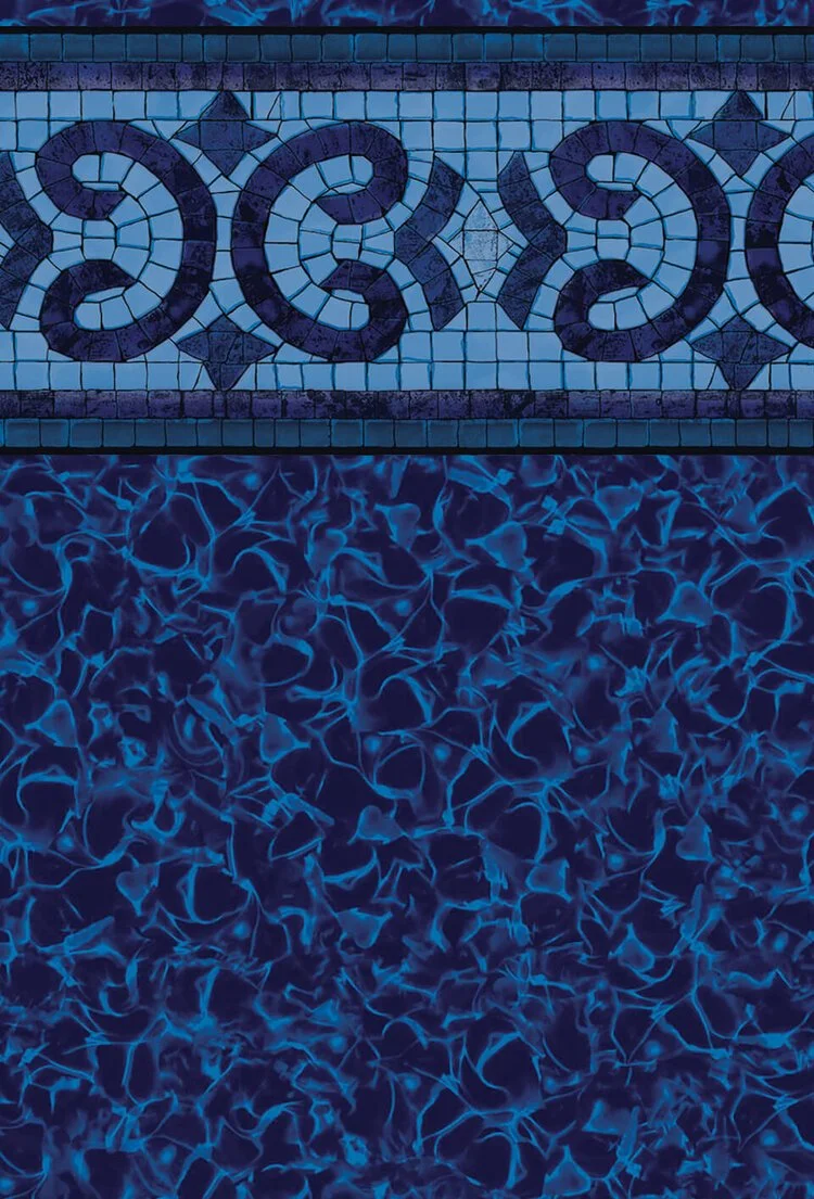 Close-up of a swimming pool with mosaic tile border and illuminated water surface at night.