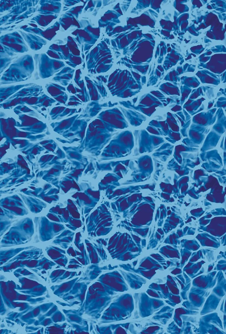 Close-up of water ripples and reflections creating a textured blue pattern.