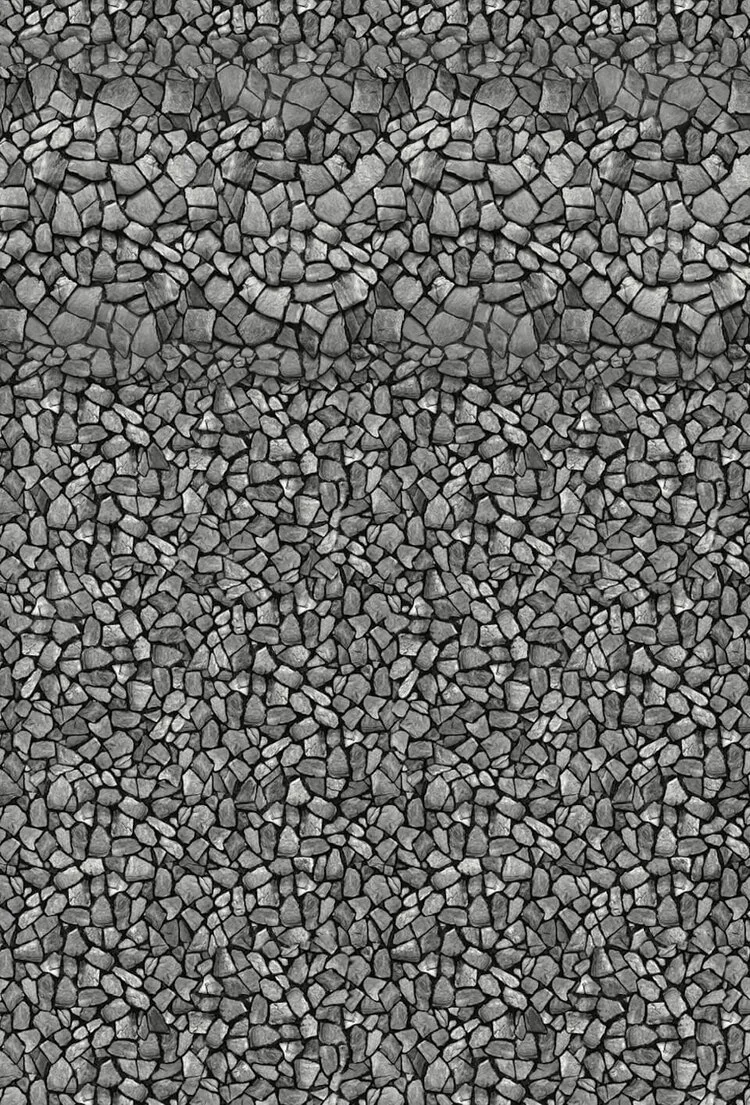 Gray gravel rocks evenly spread on the ground.
